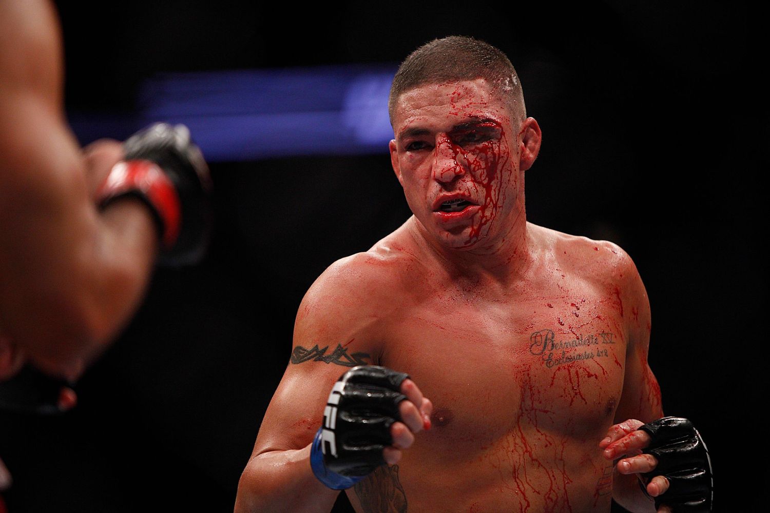 MMA fighter in fighting stance during intense UFC match.