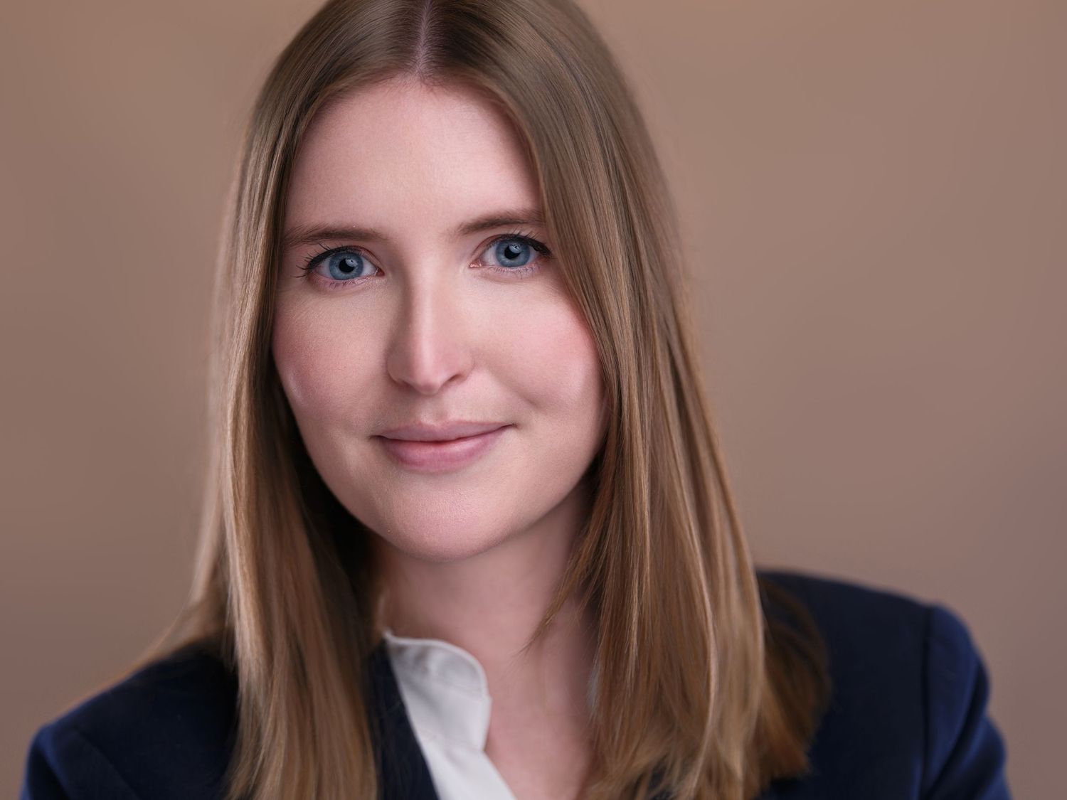 Corporate portrait sequence with someone in professional attire against soft brown backdrop.