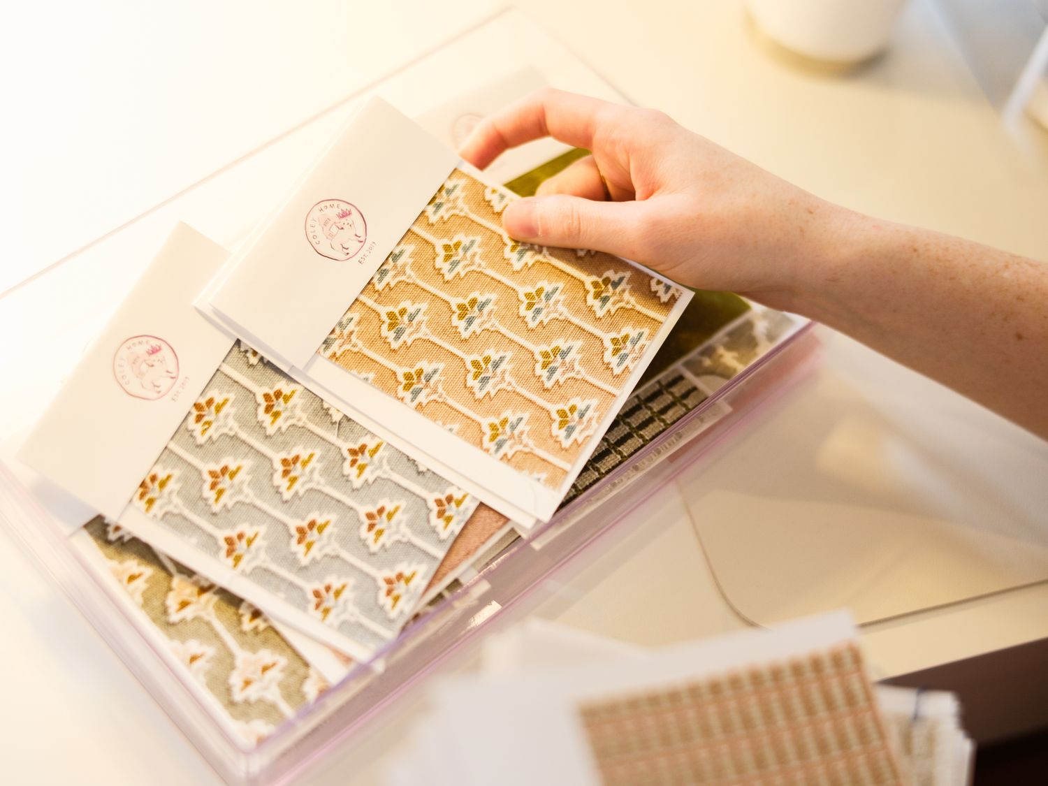 Using a silicone baking mat to flatten out and shape cookie dough into a textured pattern with small repetitive shapes.