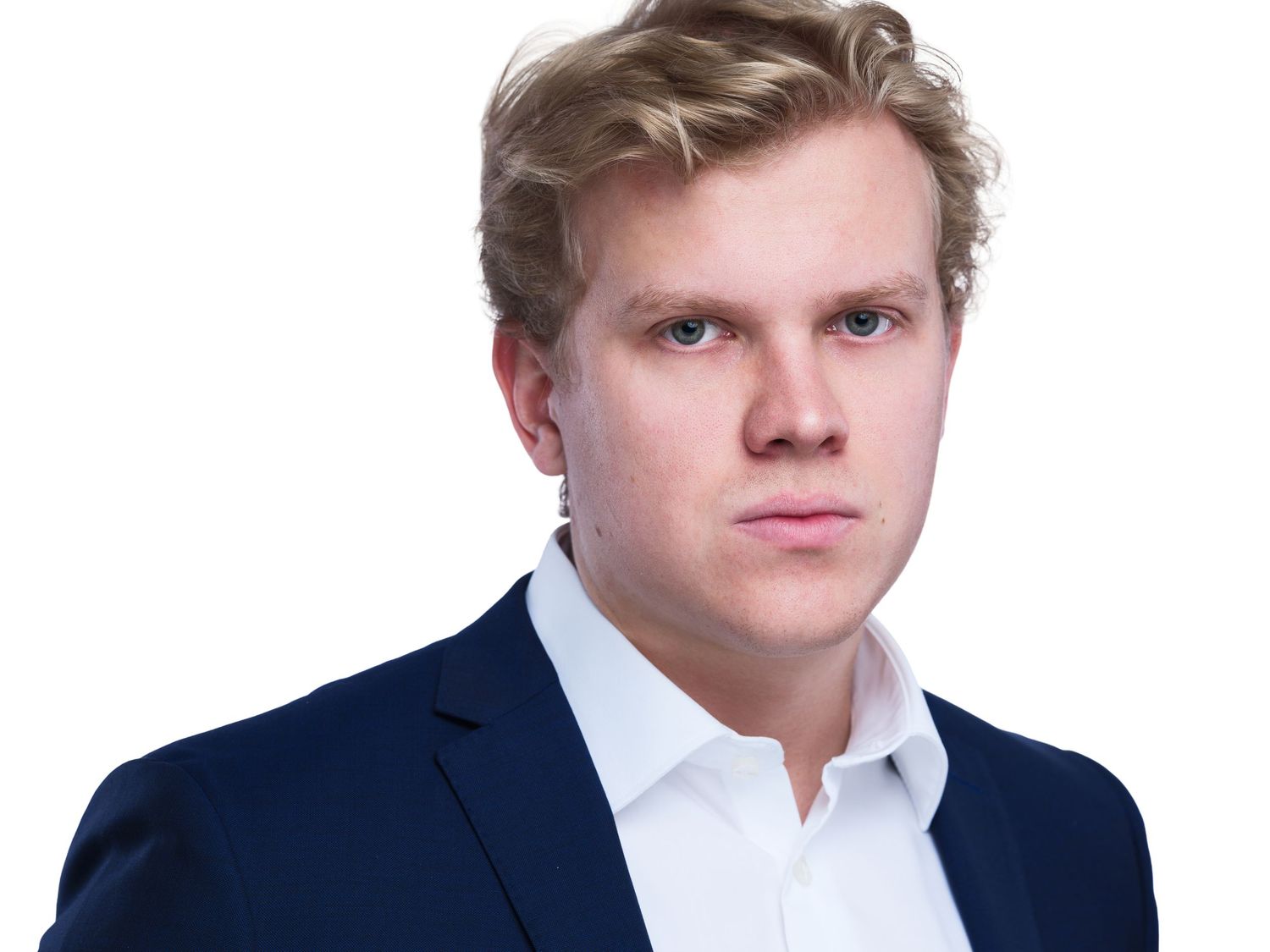 Corporate headshot sequence of a young person in navy suit and white shirt against white background.