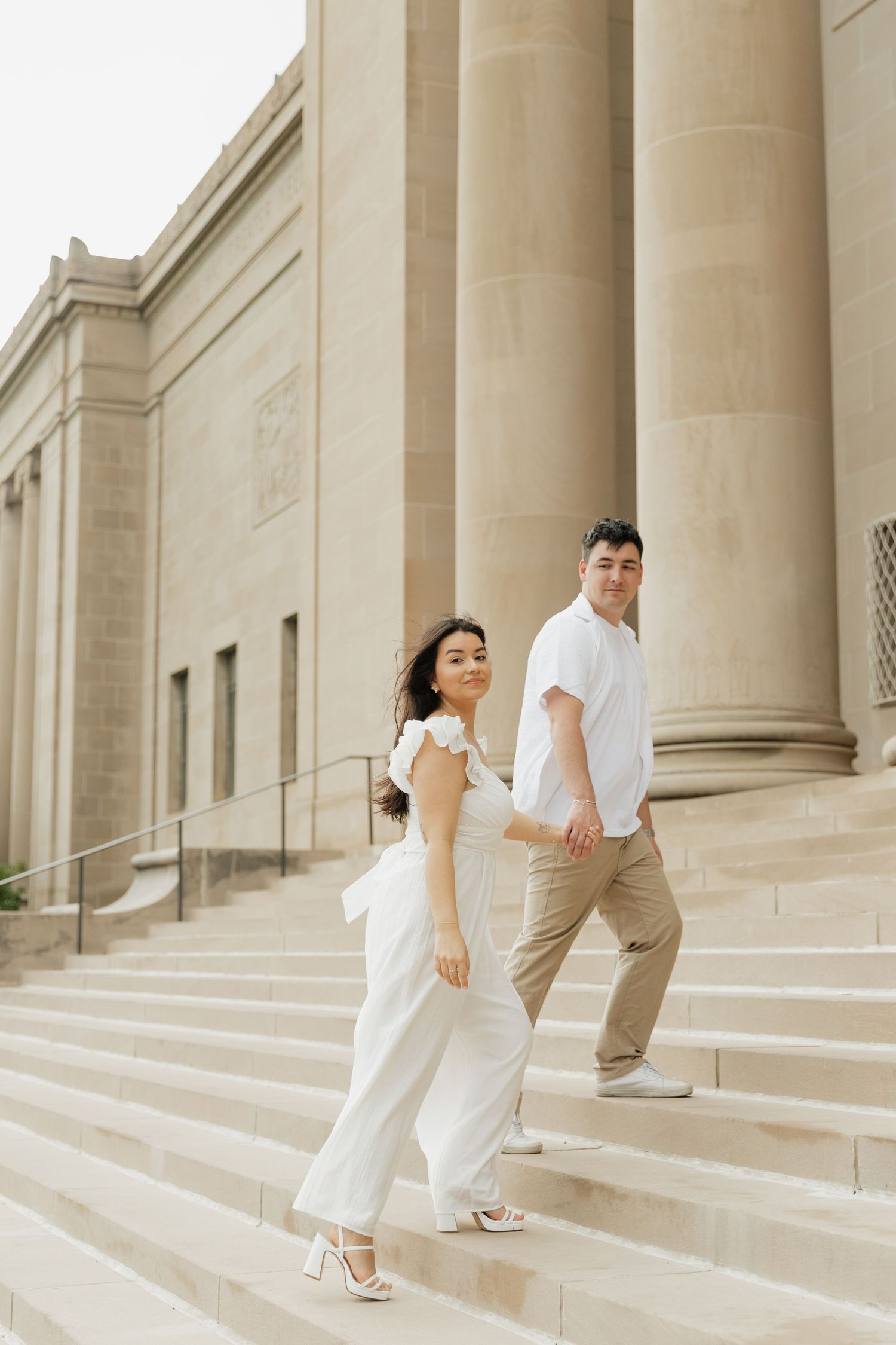 Couple walking up on the steps at Nelson-Atkins Museum