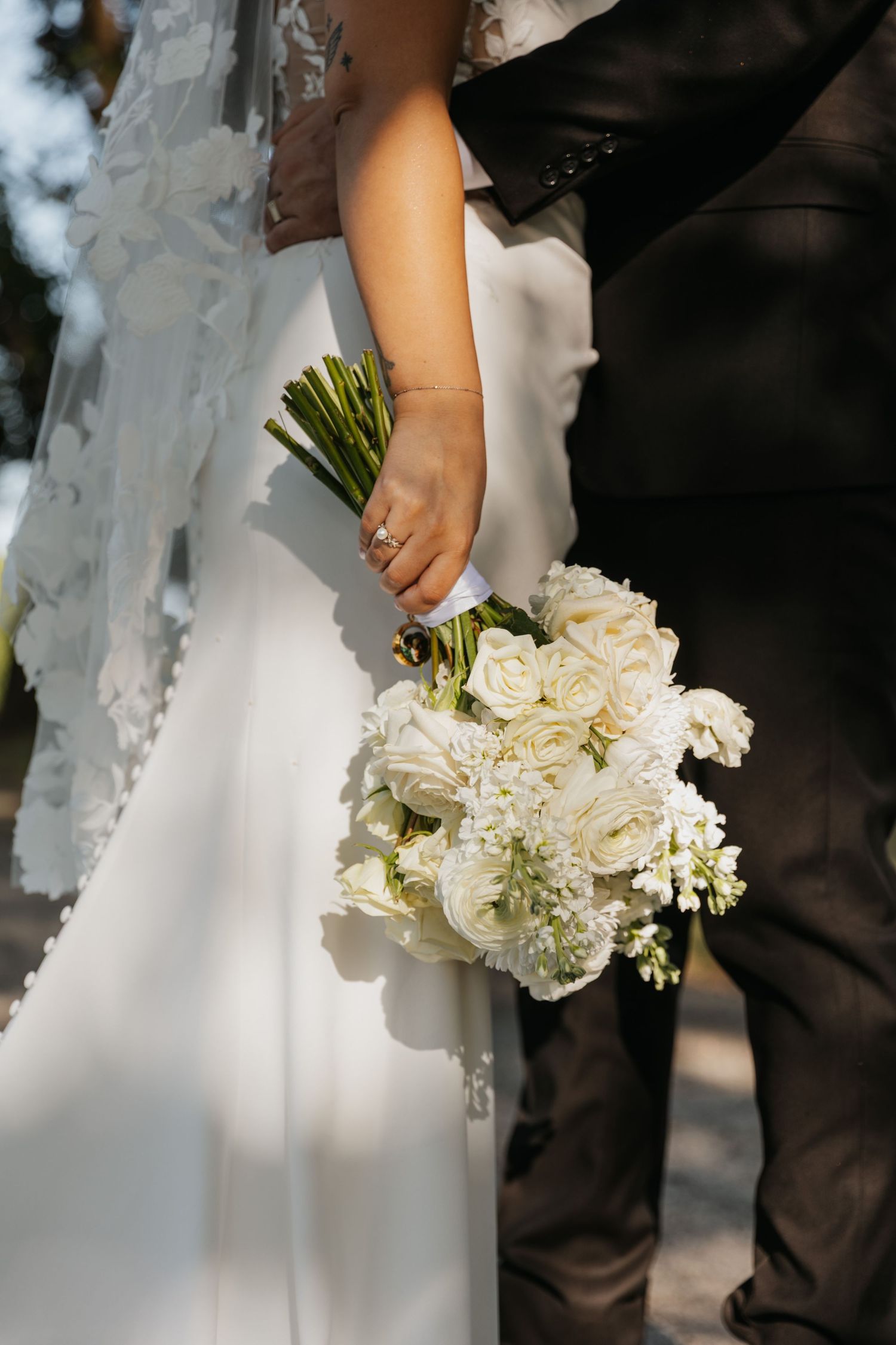 Bride’s bouquet glowing in natural sunlight during wedding photos