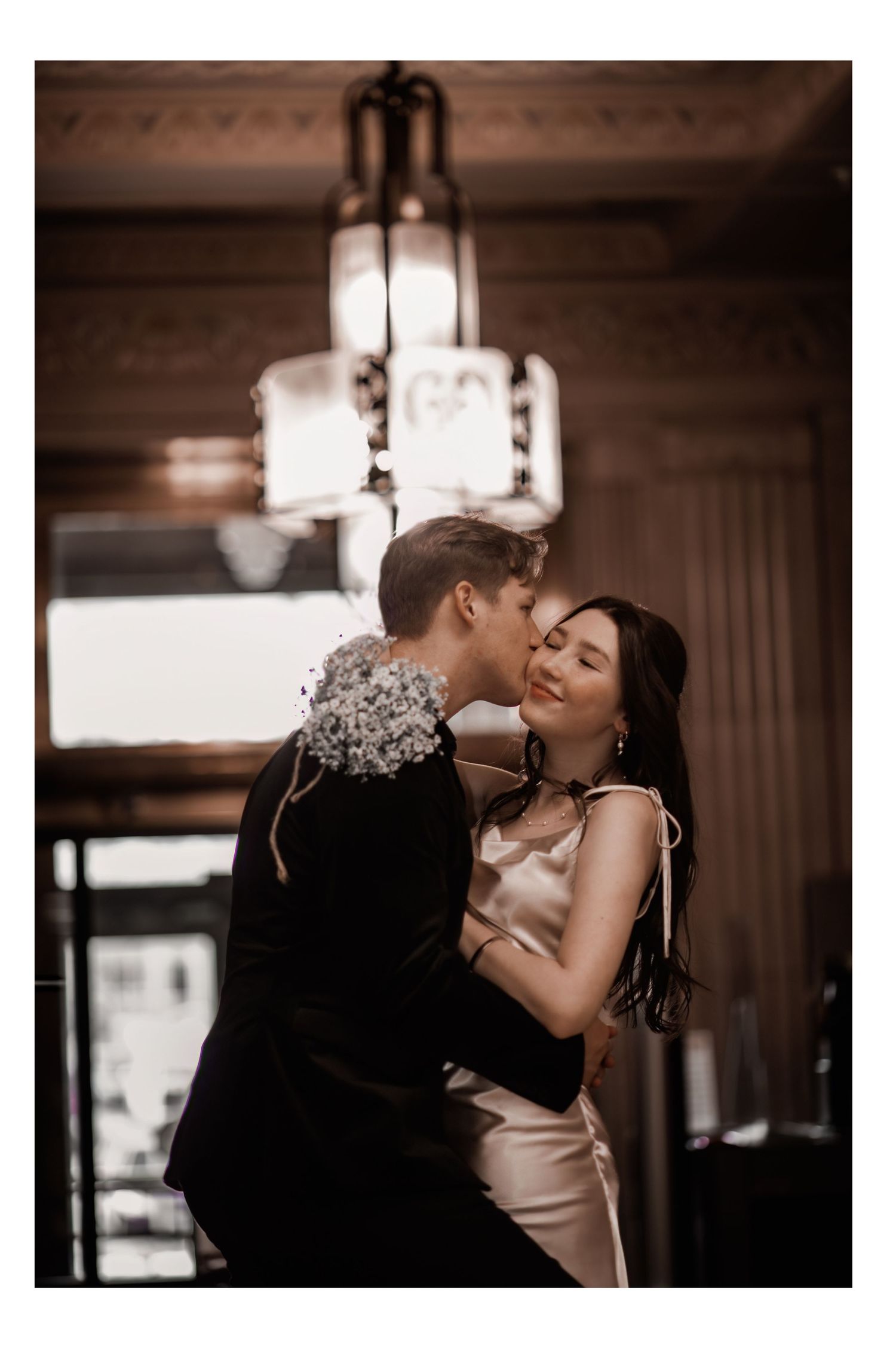 A romantic couple dancing together in an intimate embrace at their court house wedding.
