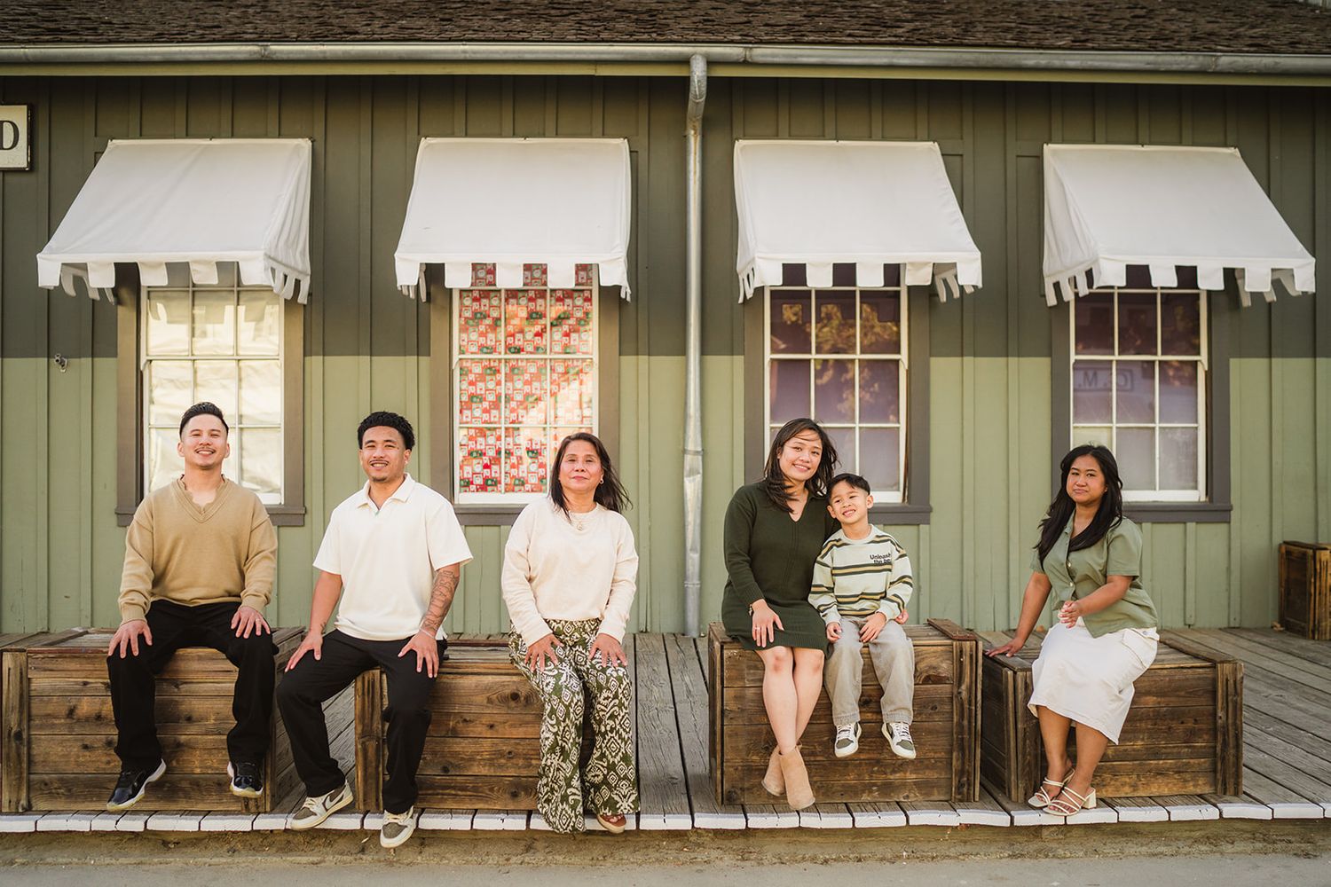 Multiple candid family photos displayed in a horizontal sequence showing outdoor gatherings and porch scenes.