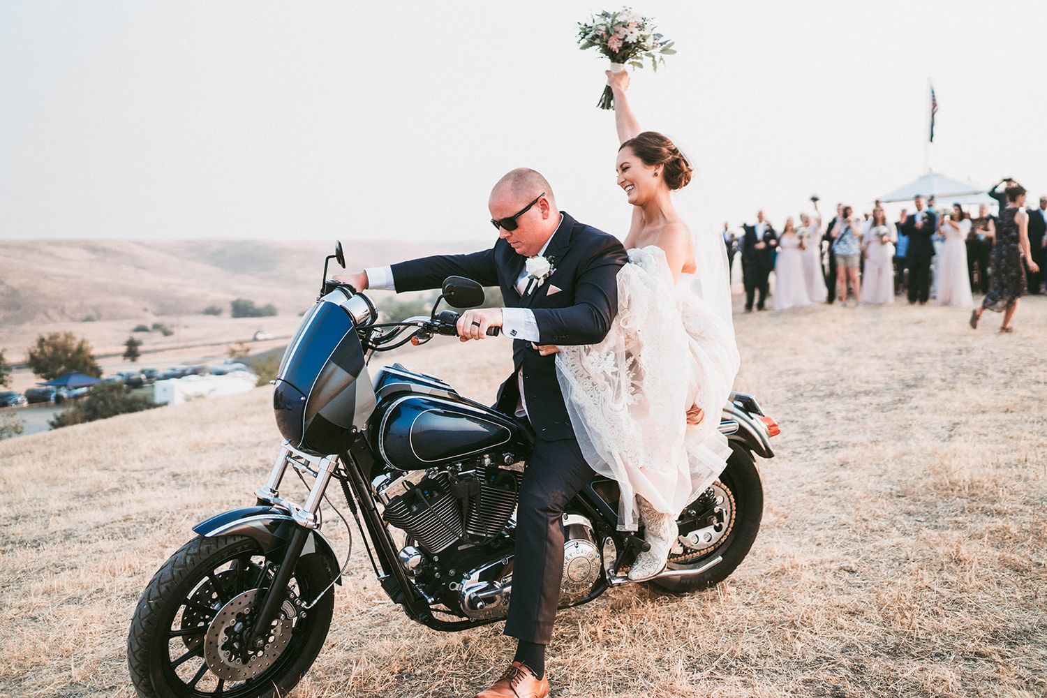 Wedding portraits featuring a motorcycle adding an edgy element to the romantic scene.