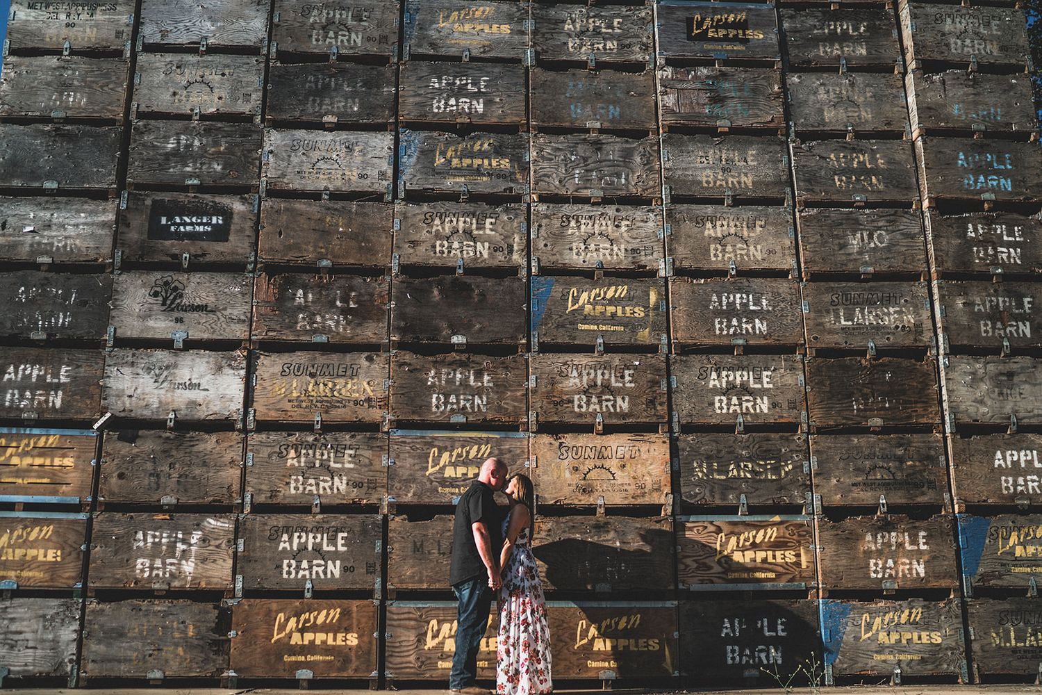 Rustic wall covered in vintage wooden crates creates textured background pattern.