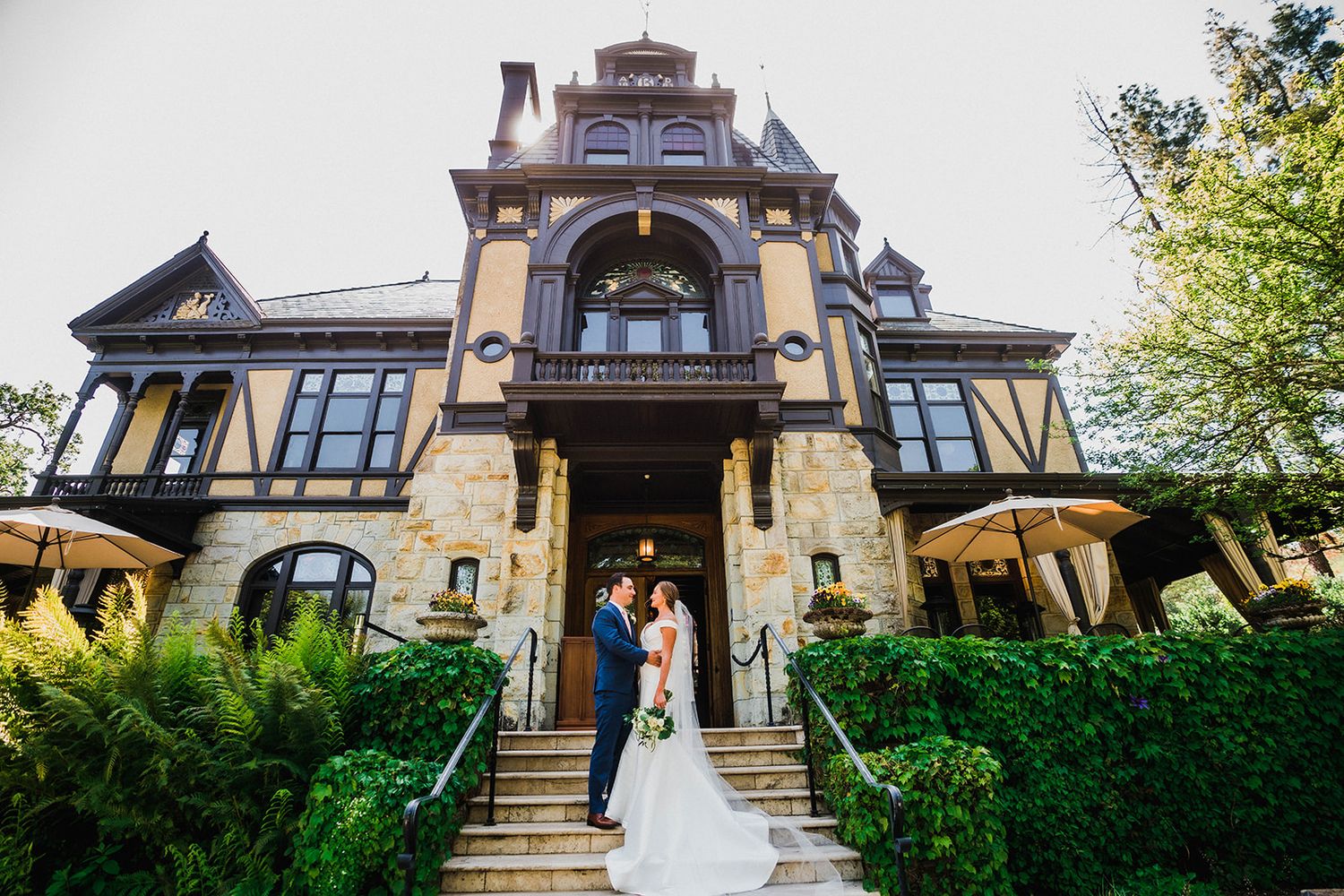 Elegant Victorian-style mansion venue with stone facade and ornate architecture.