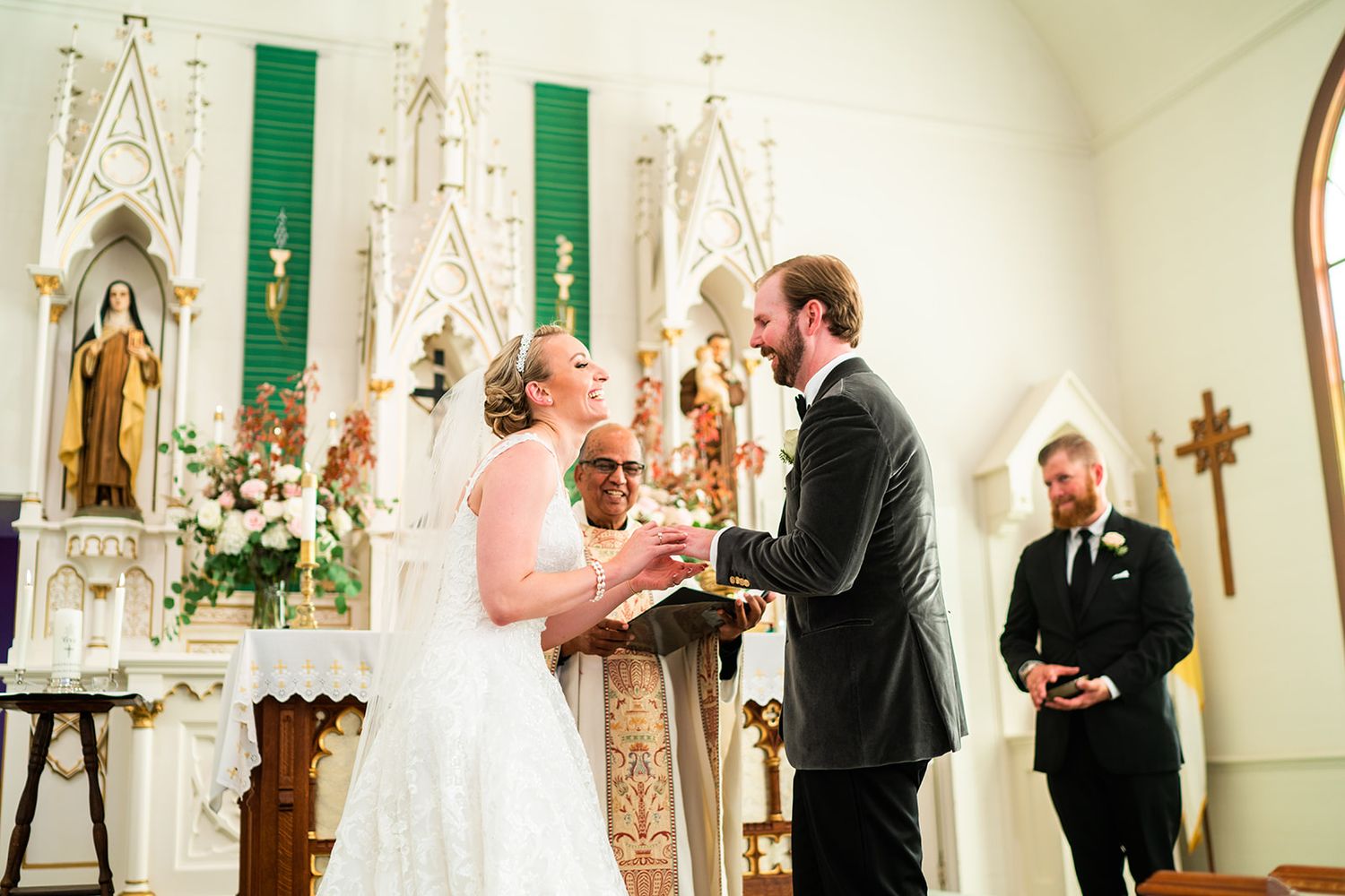 Romantic wedding ceremony moments captured inside a traditional church with ornate white details and green accents.