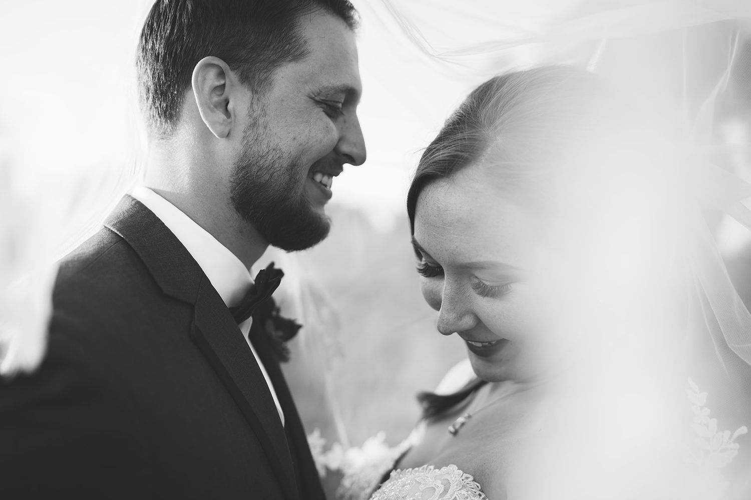 Artistic black and white close-up romantic portraits of newlyweds.