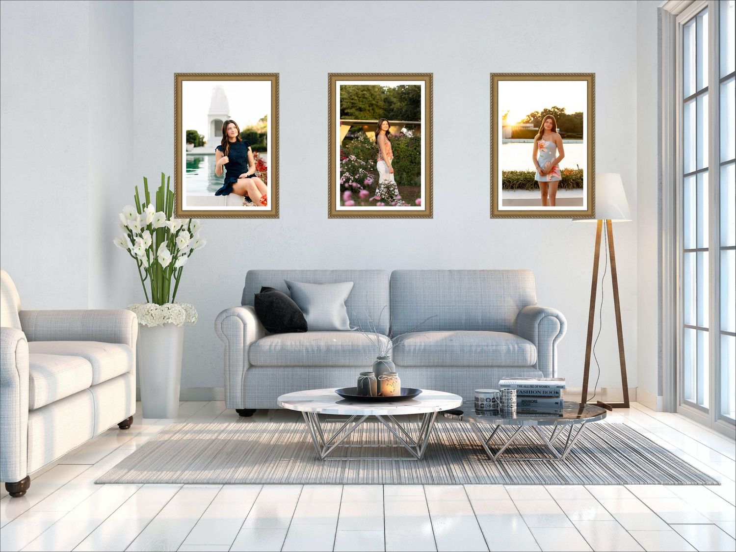 Three framed portrait photos displayed above a gray sofa in a bright modern living room with white walls and hardwood floors.