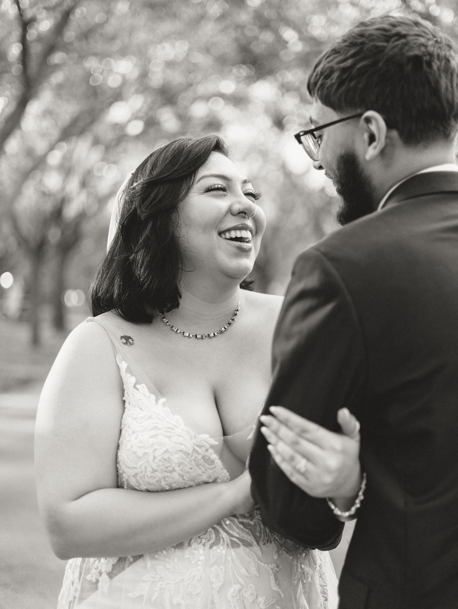 Joyful couple dancing together outdoors during their wedding celebration.