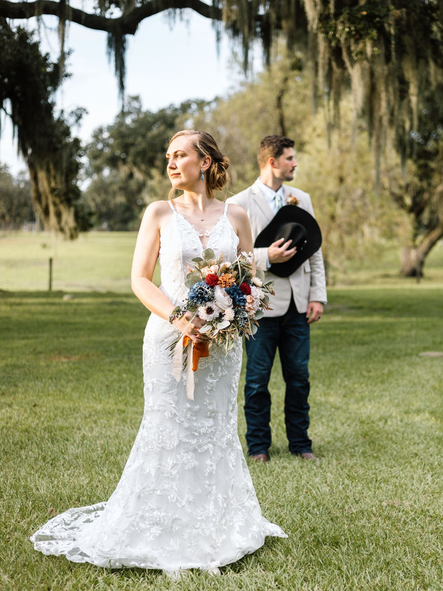 A collection of outdoor rustic wedding photos showing the bride's lace dress details and floral bouquet in a natural setting.