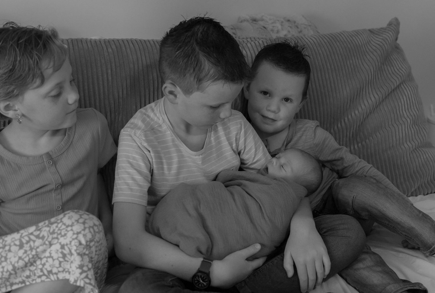 Family photo of 4 siblings in their home