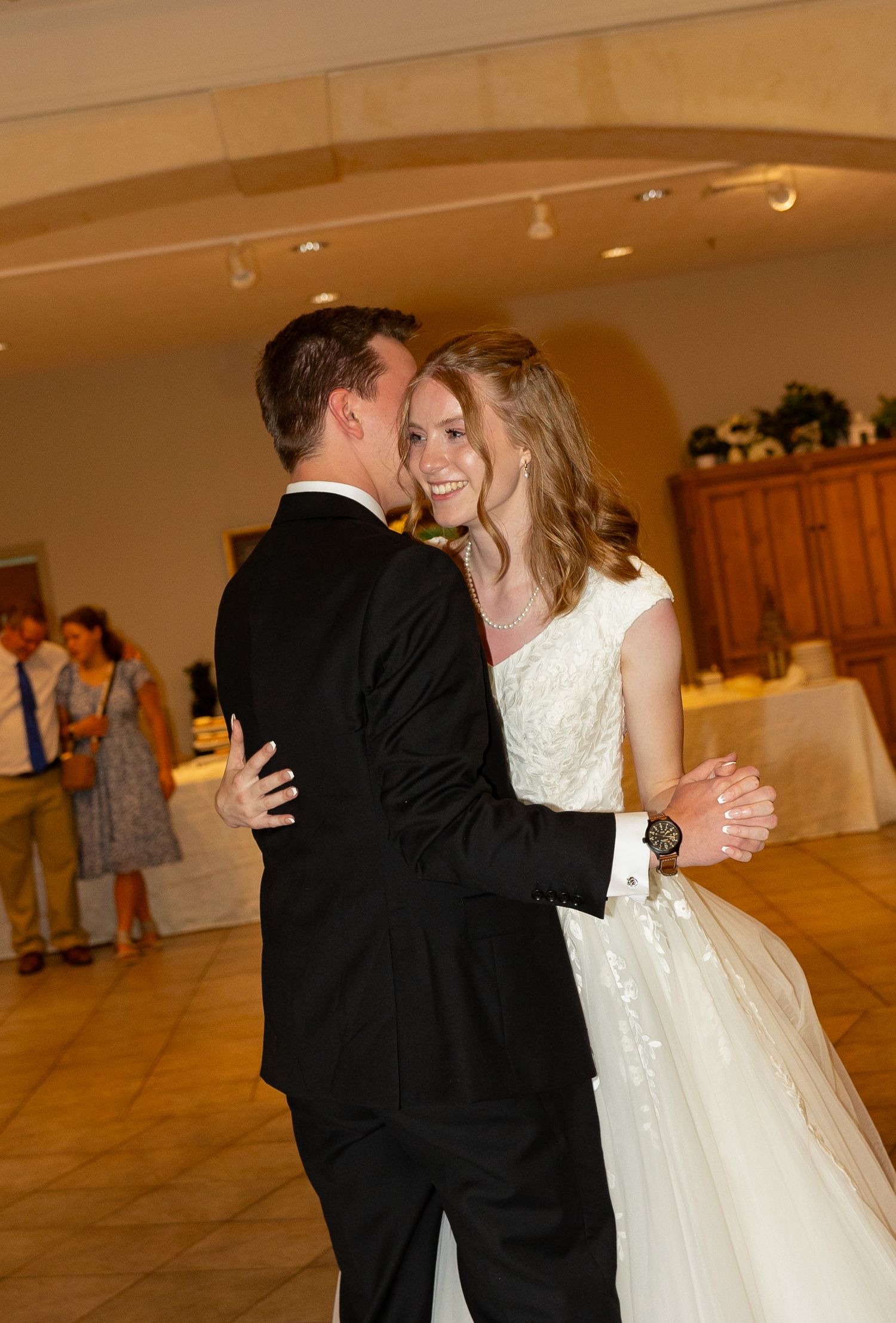 A bride and groom dancing at their reception