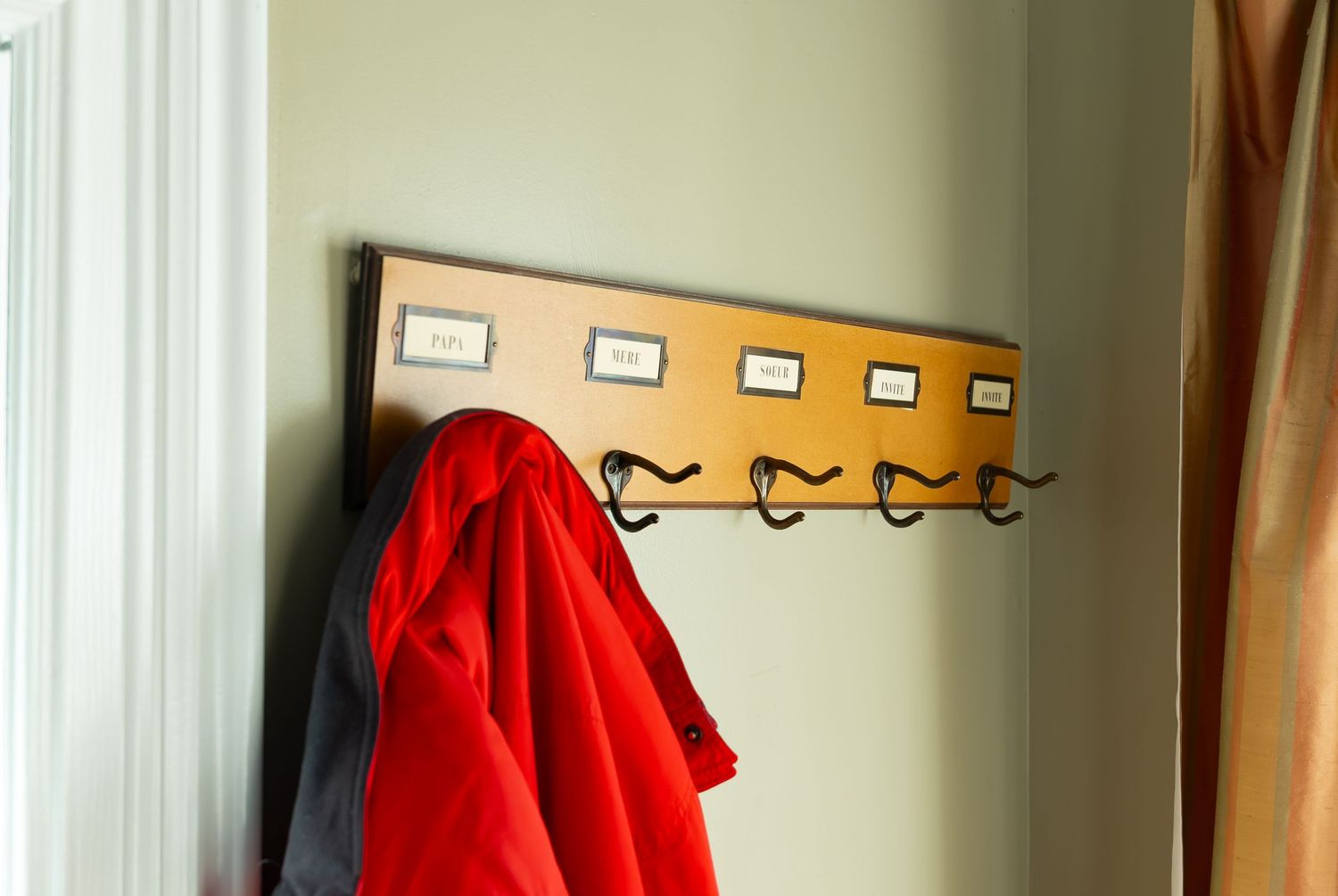 Photo of red coat on a coat hanger