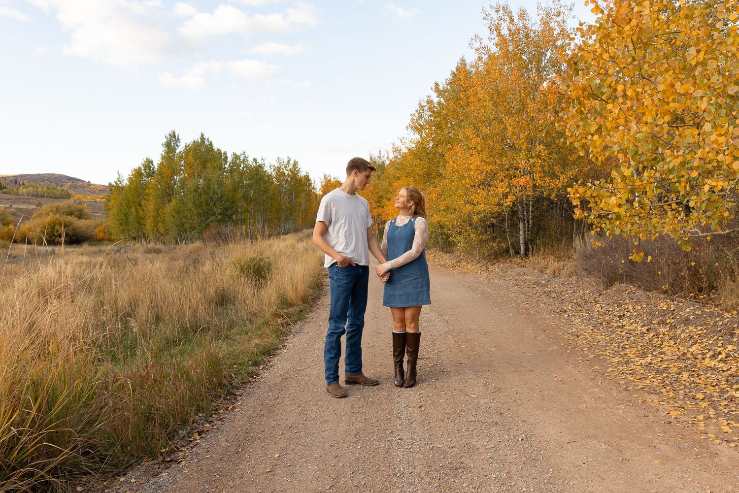A couple standing in fall scenery
