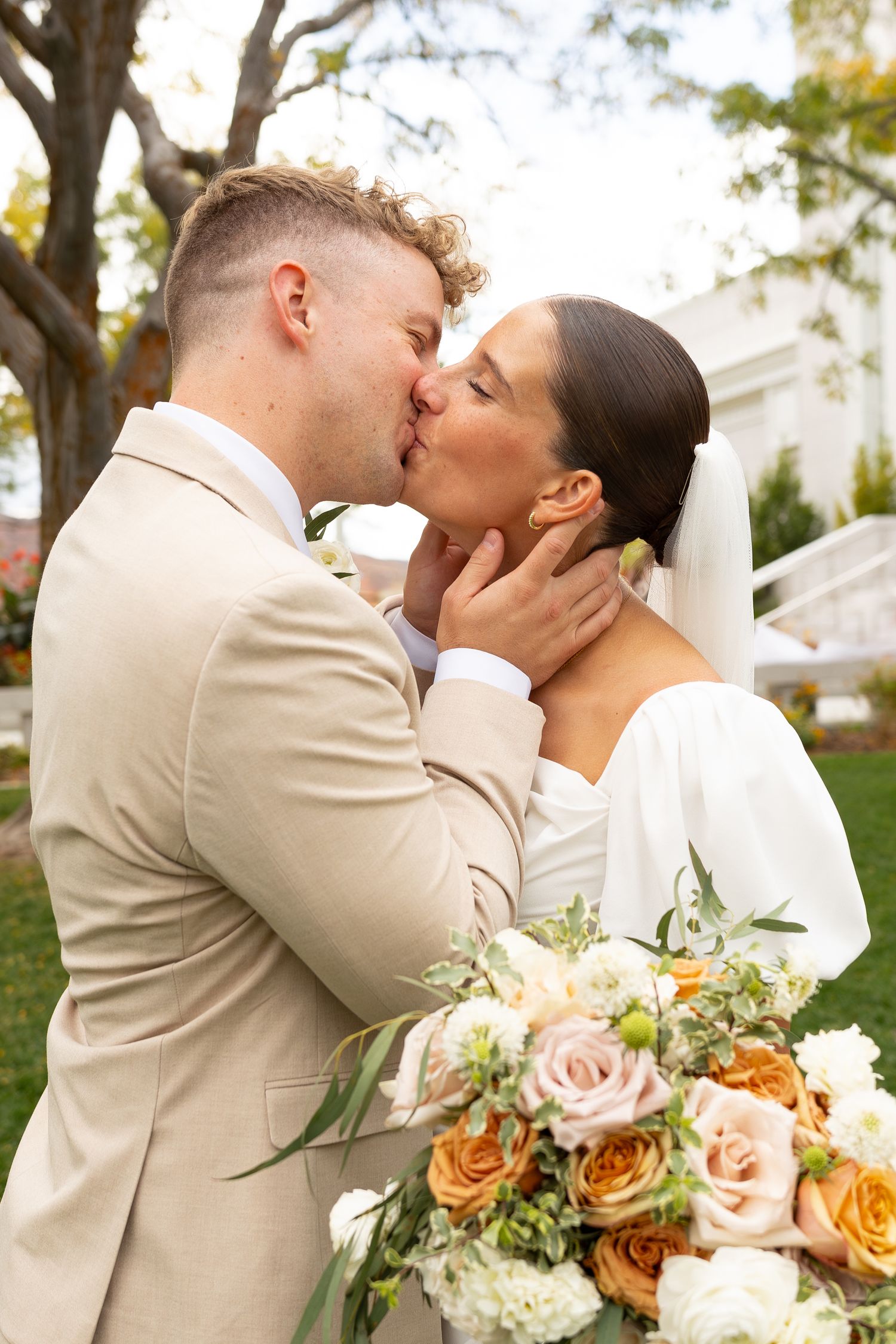 A bride and groom kissing