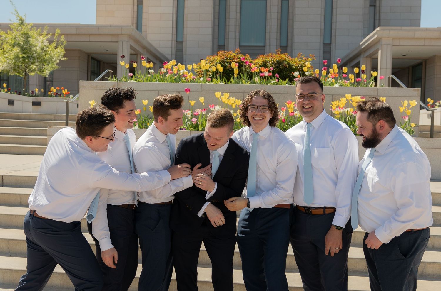 A groom and his groomsmen joking around