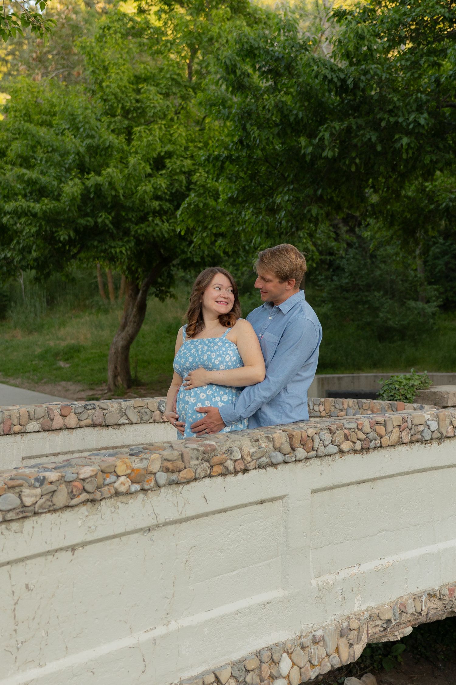 Maternity photo of a couple on a bridge
