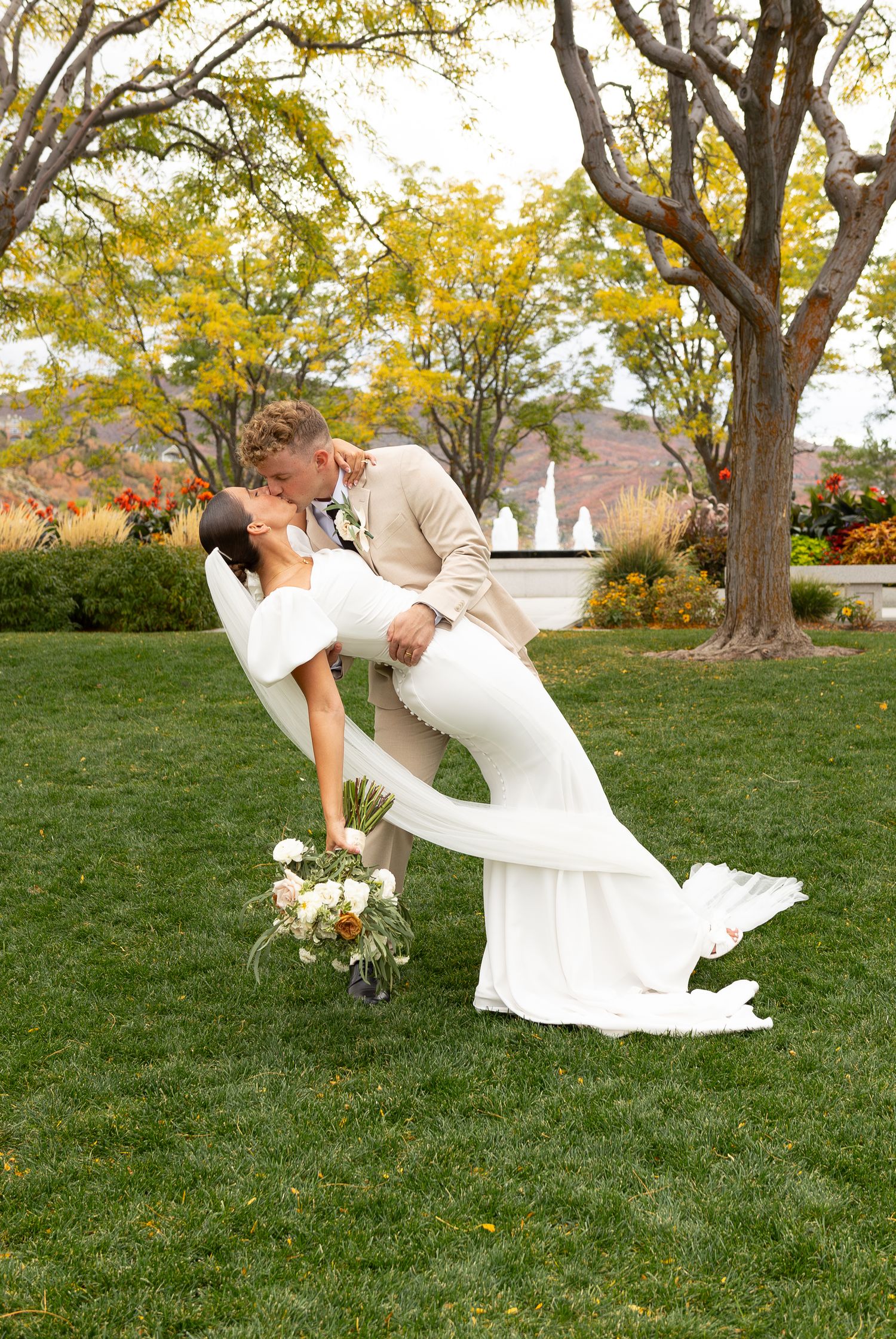 A groom holding his bride in a dip