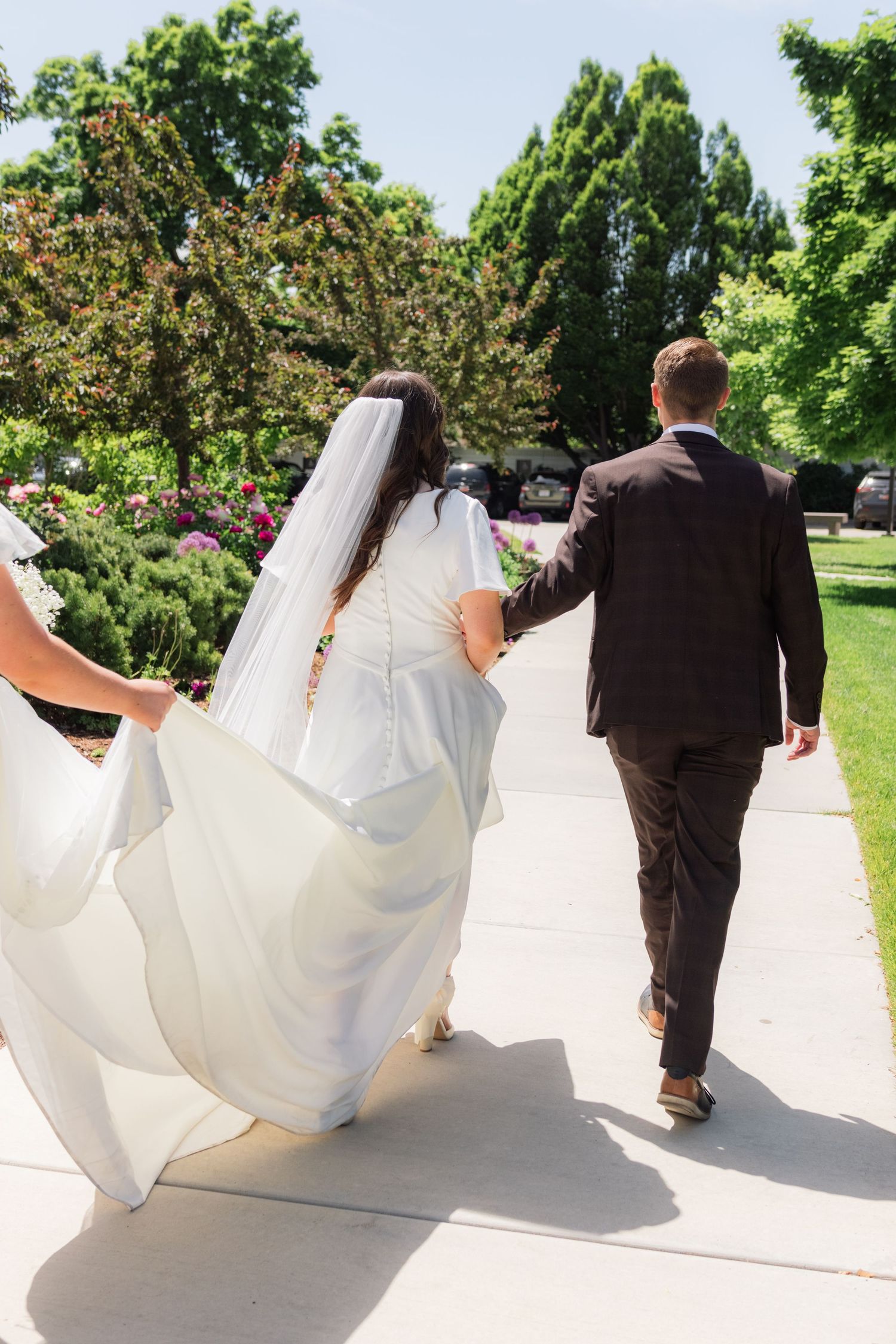 A bride and groom walking
