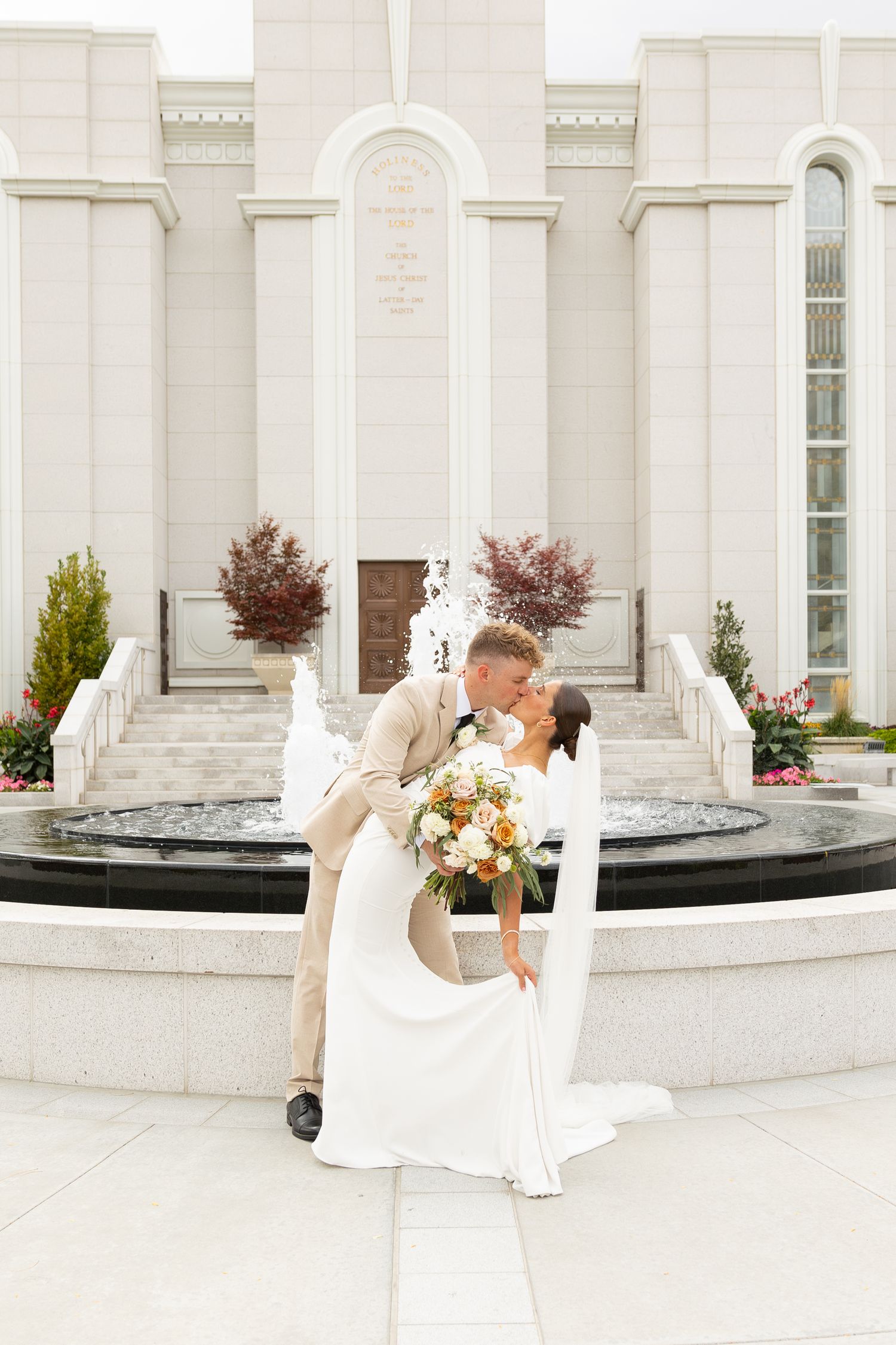 A bride and groom kissing