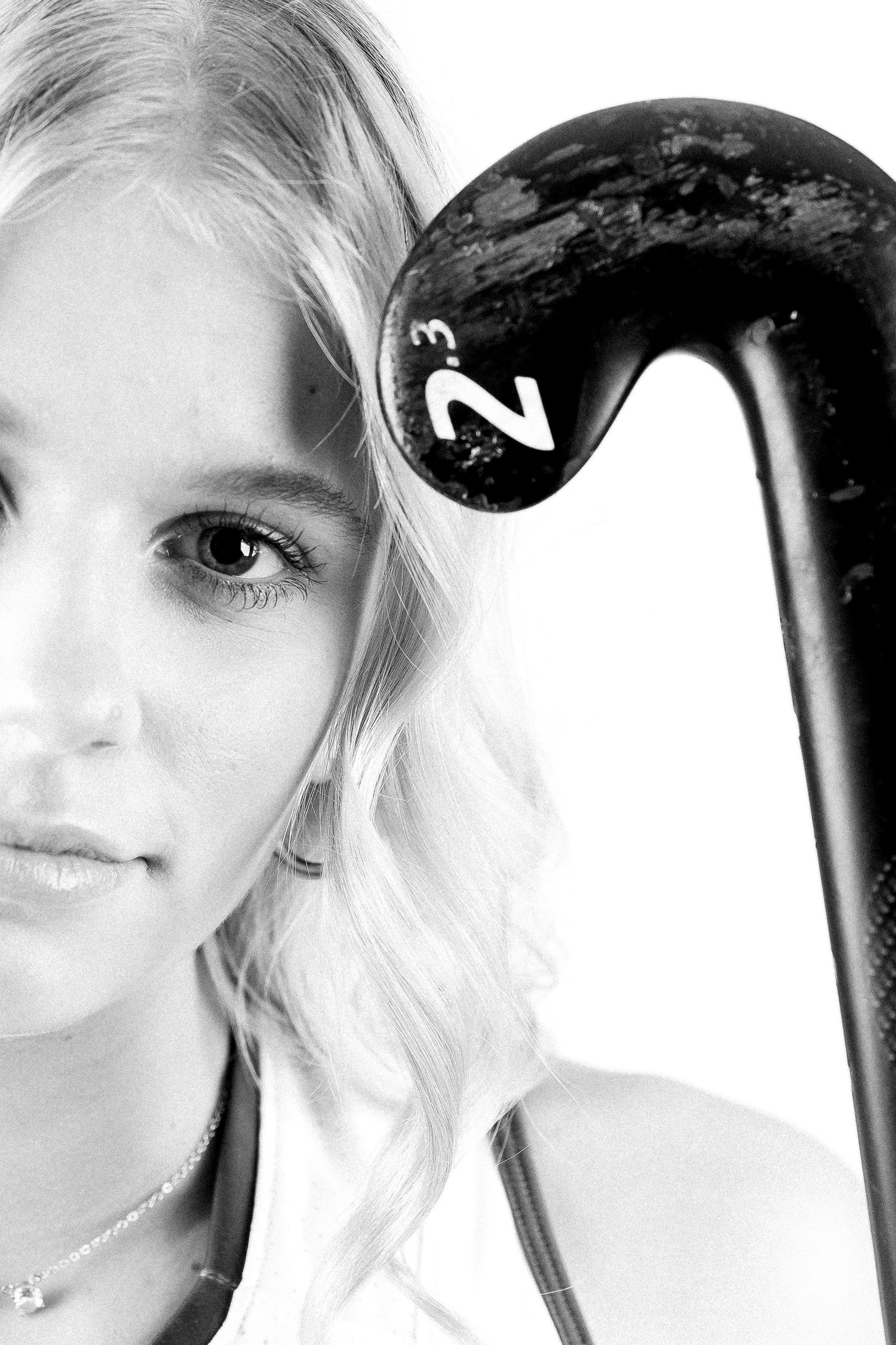 Black and white artistic sports portrait showing striking contrast against a bright background for new hampshire senior photoshoot.