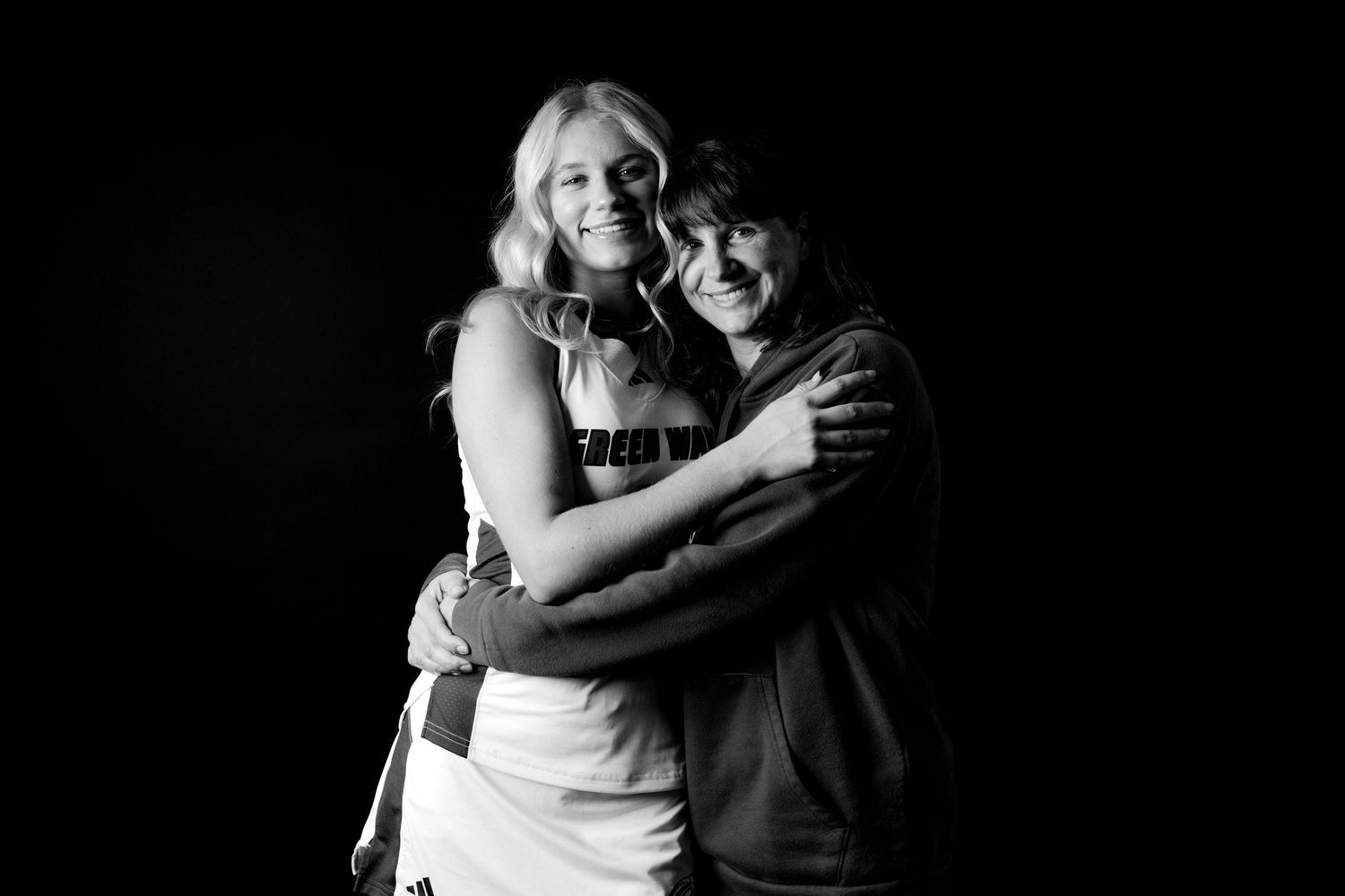 Black and white studio sports photos and emotional embrace moments.