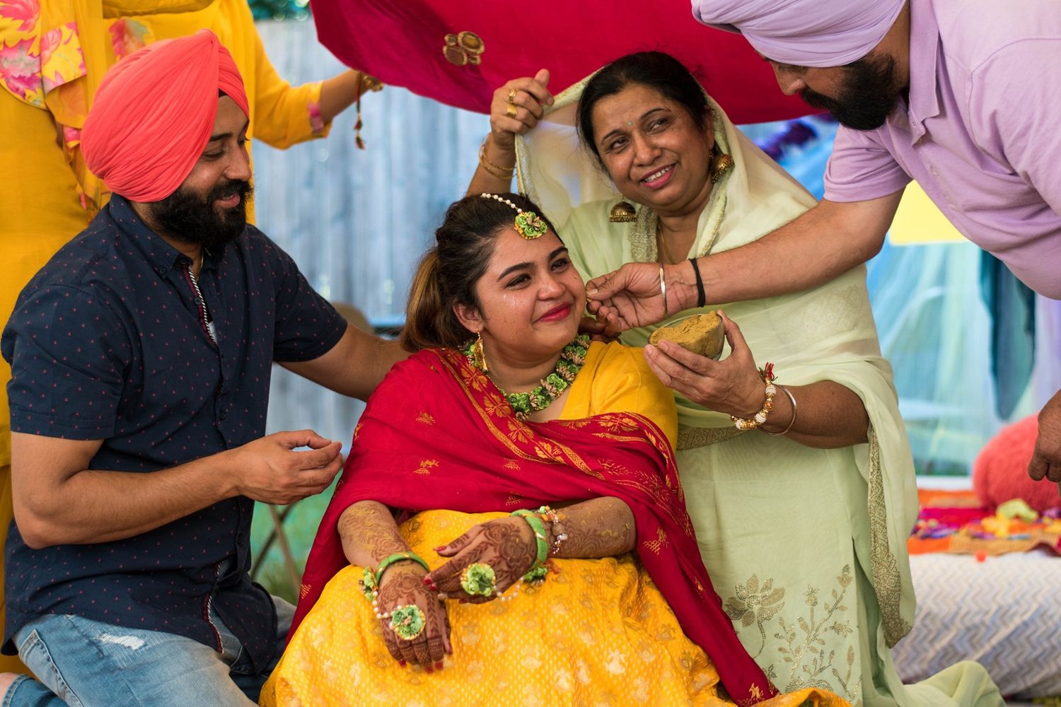 Traditional Indian wedding ceremony with guests in colorful attire.