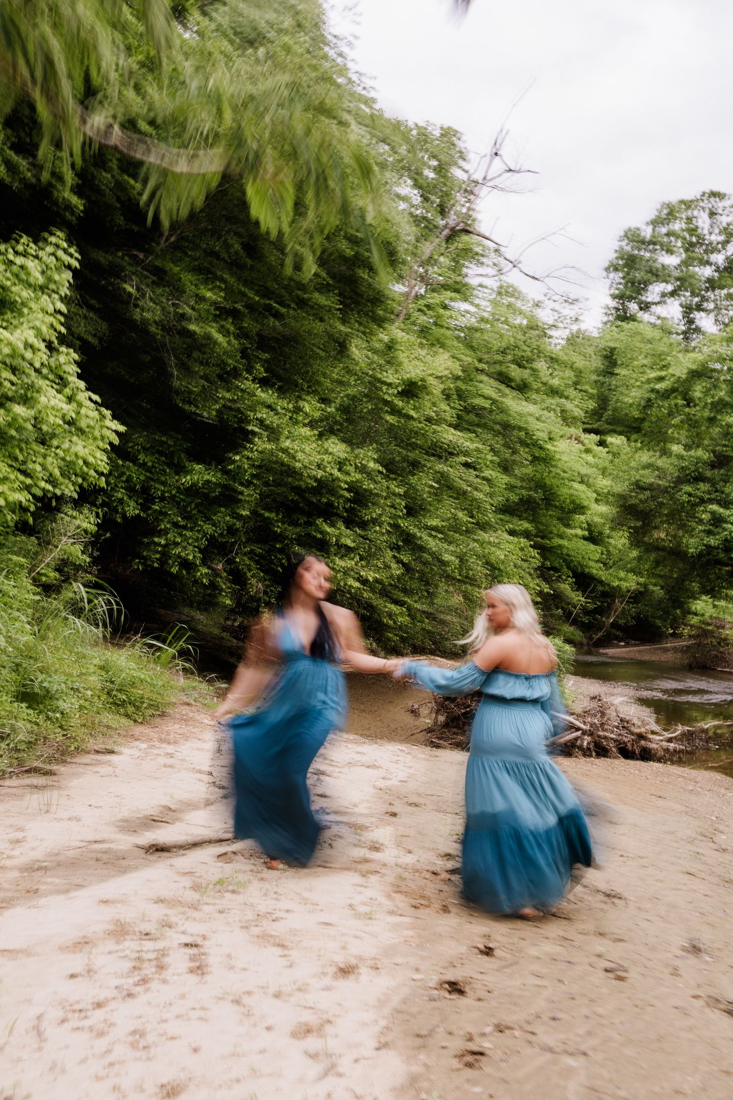 A sequence of dance movements in a blue dress captured against a natural outdoor setting.
