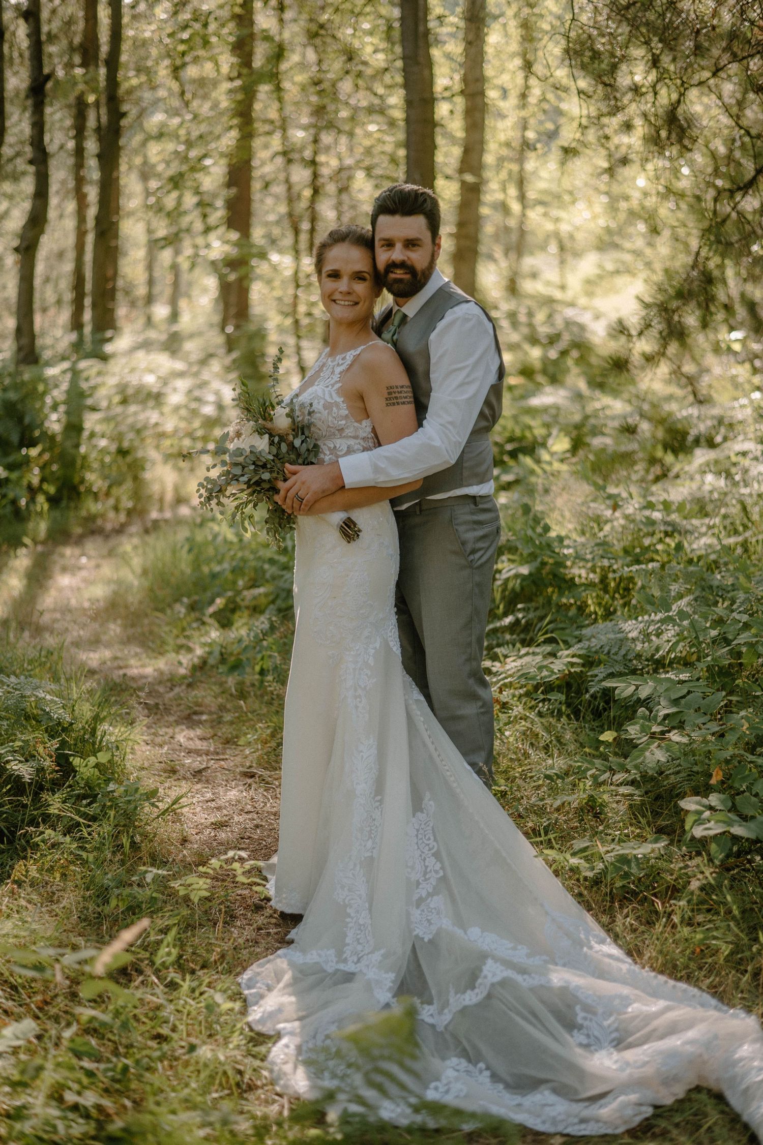 Bride and groom in the forrest with light leaks