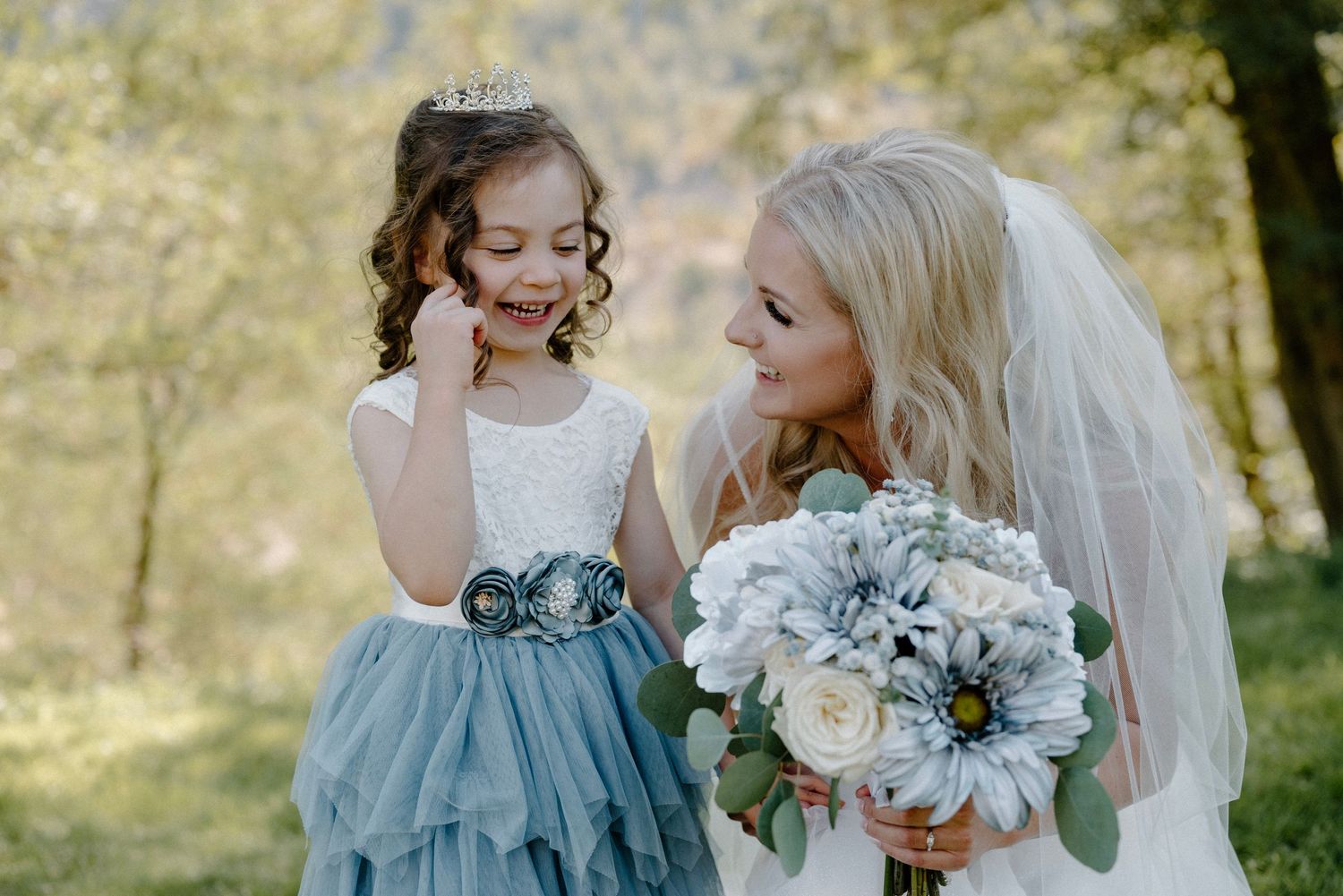 Bride and flower girl talking