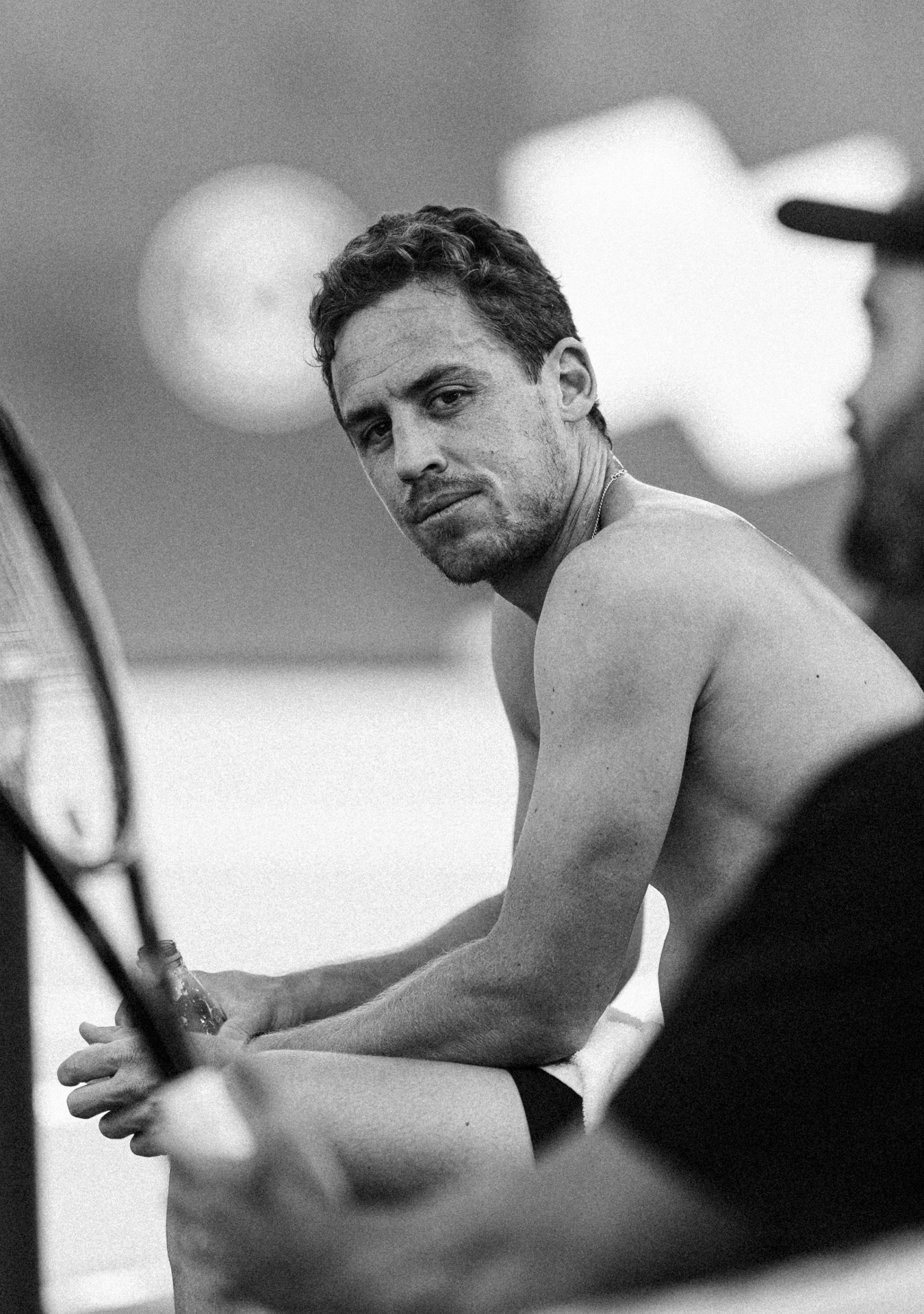 Black and white close-up shots showing intense concentration and focus during a tennis match.