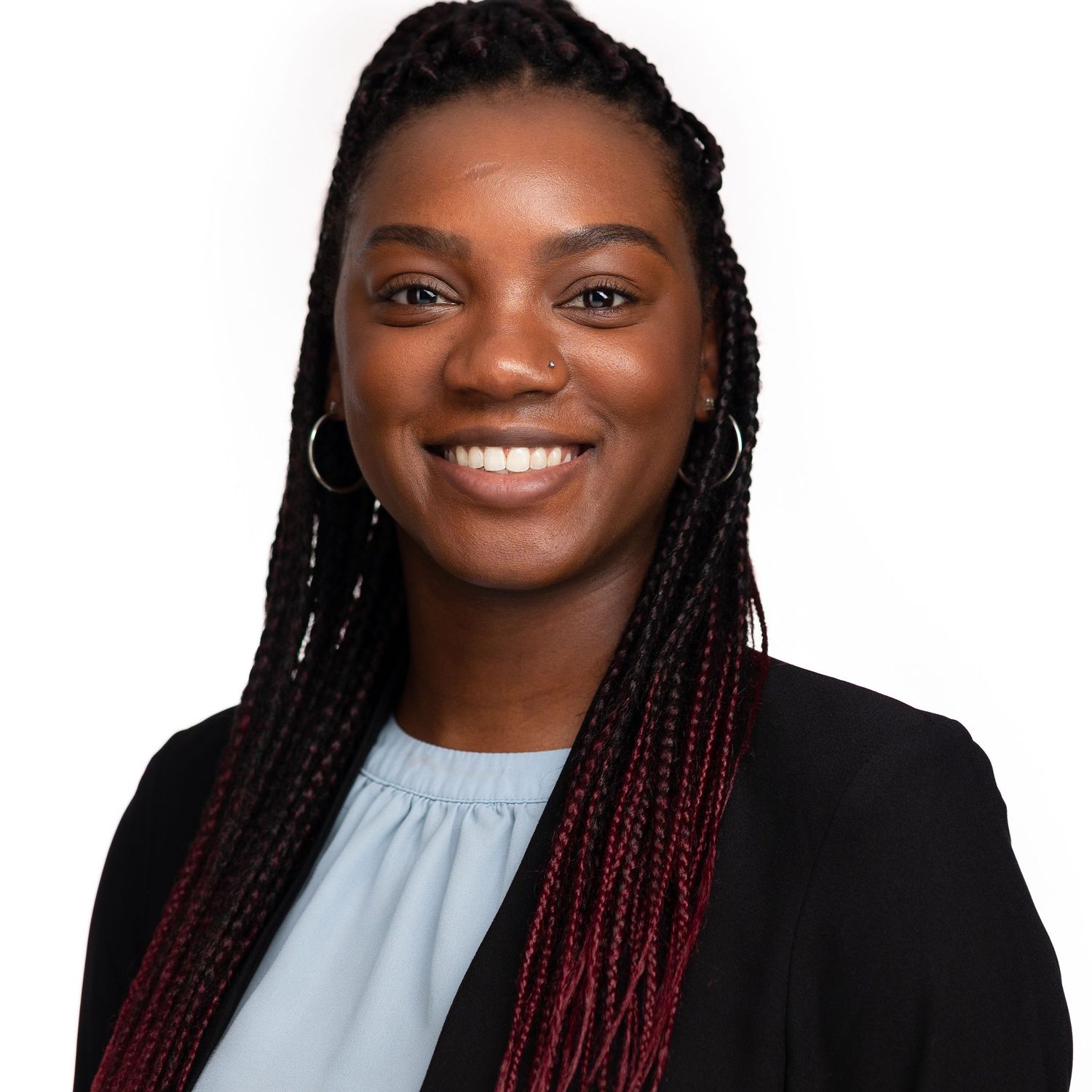 Professional headshot composite showing four different poses wearing elegant business attire against neutral background.