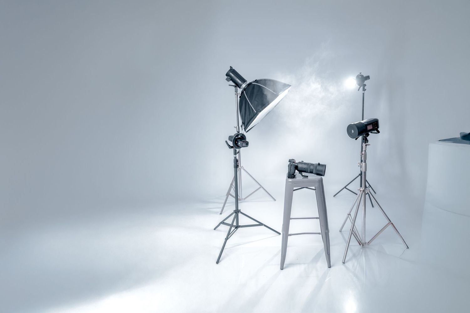 Studio lighting equipment setup against gray background.