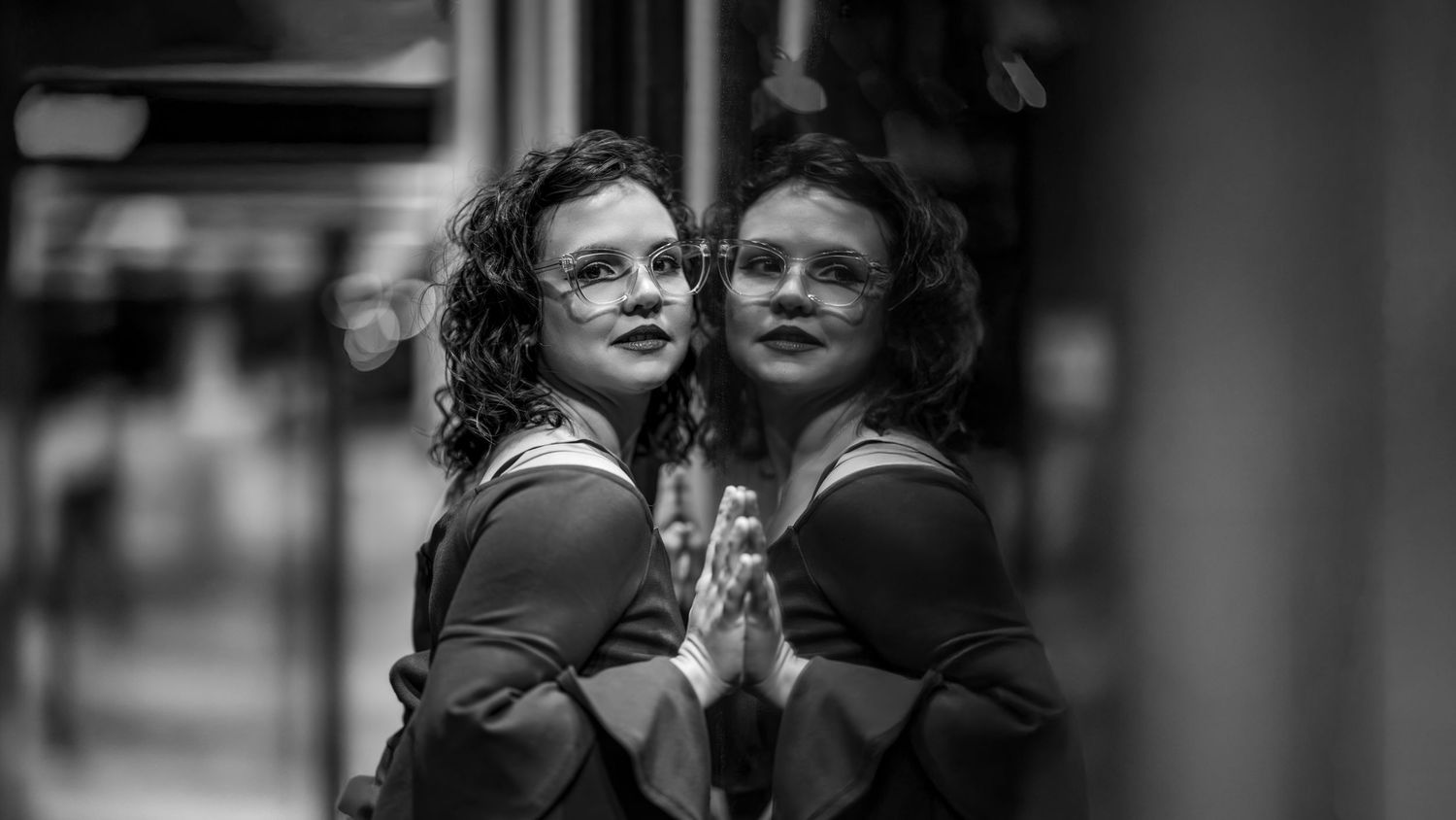 Black and white urban photography with soft focus and dramatic shadows.