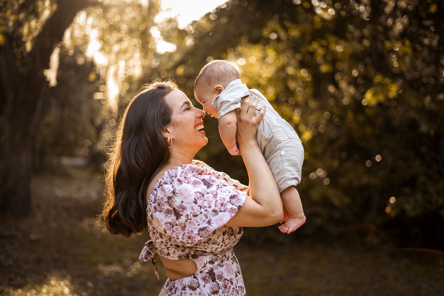Tender candid portraits of family bonding together in a sunlit garden during golden hour.