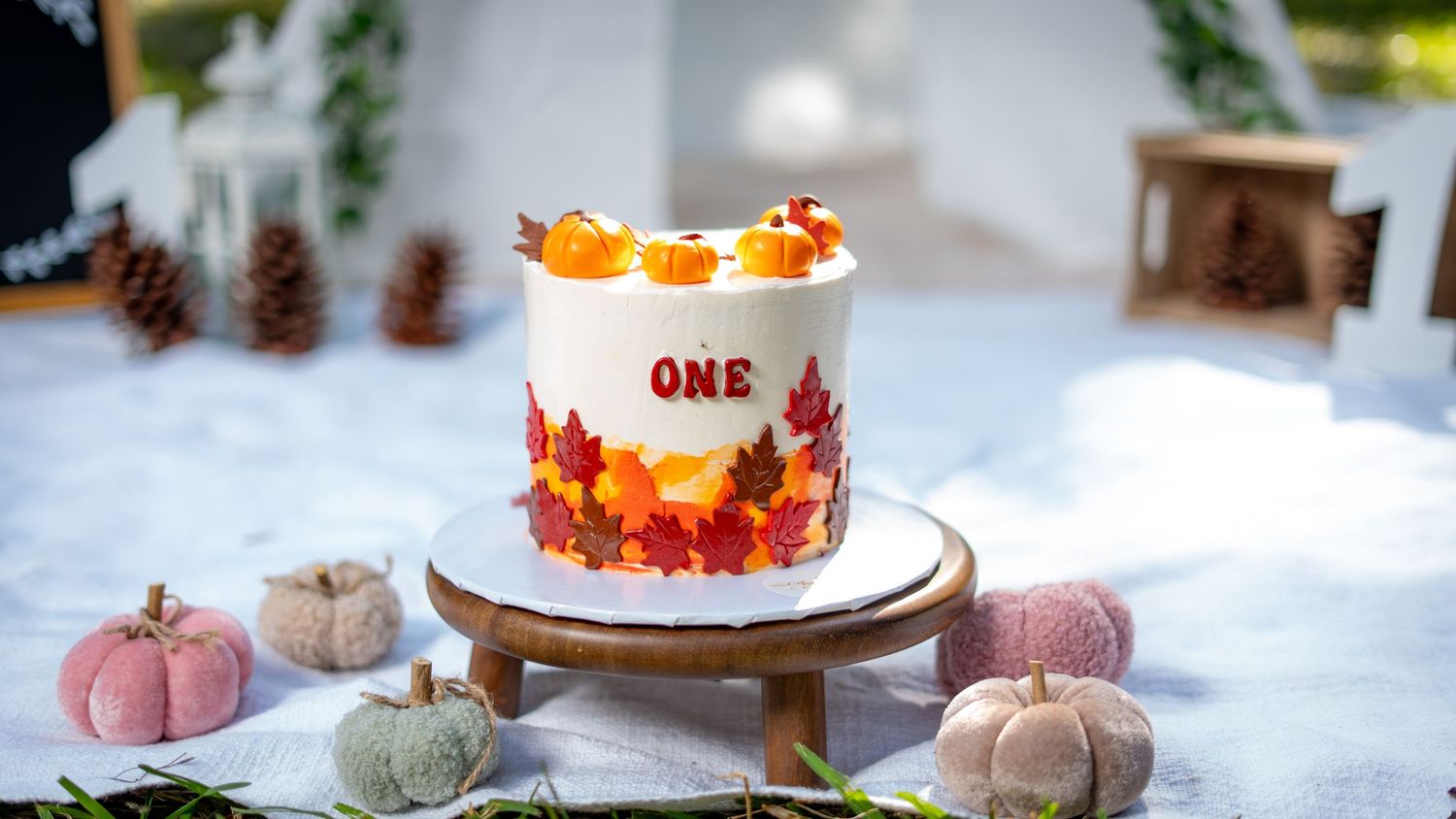 A collection of fall decor photos featuring pumpkins, pinecones, and autumn-themed table settings with warm colors.