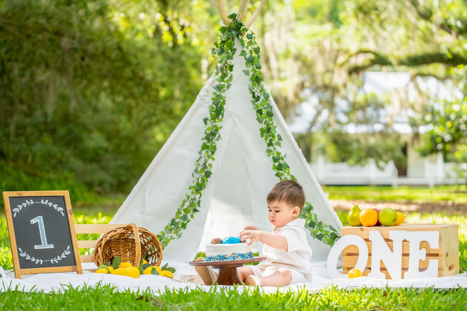 Boho teepee setup with decorative elements for outdoor celebration.