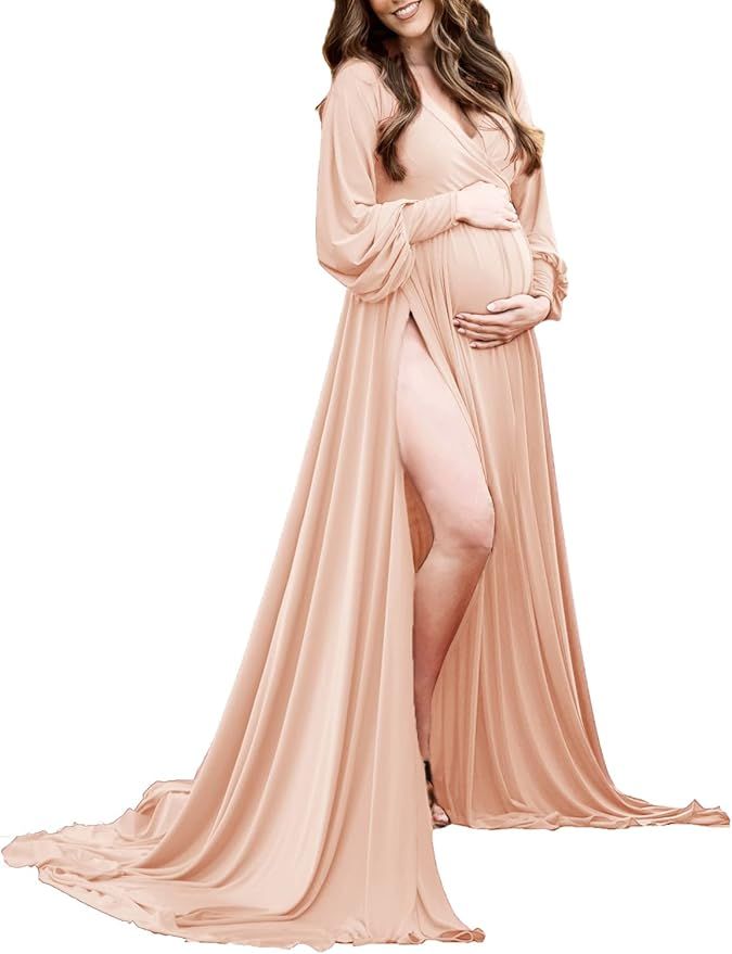 Elegant peach-colored maternity gown with flowing train and off-shoulder design for photo shoots.
