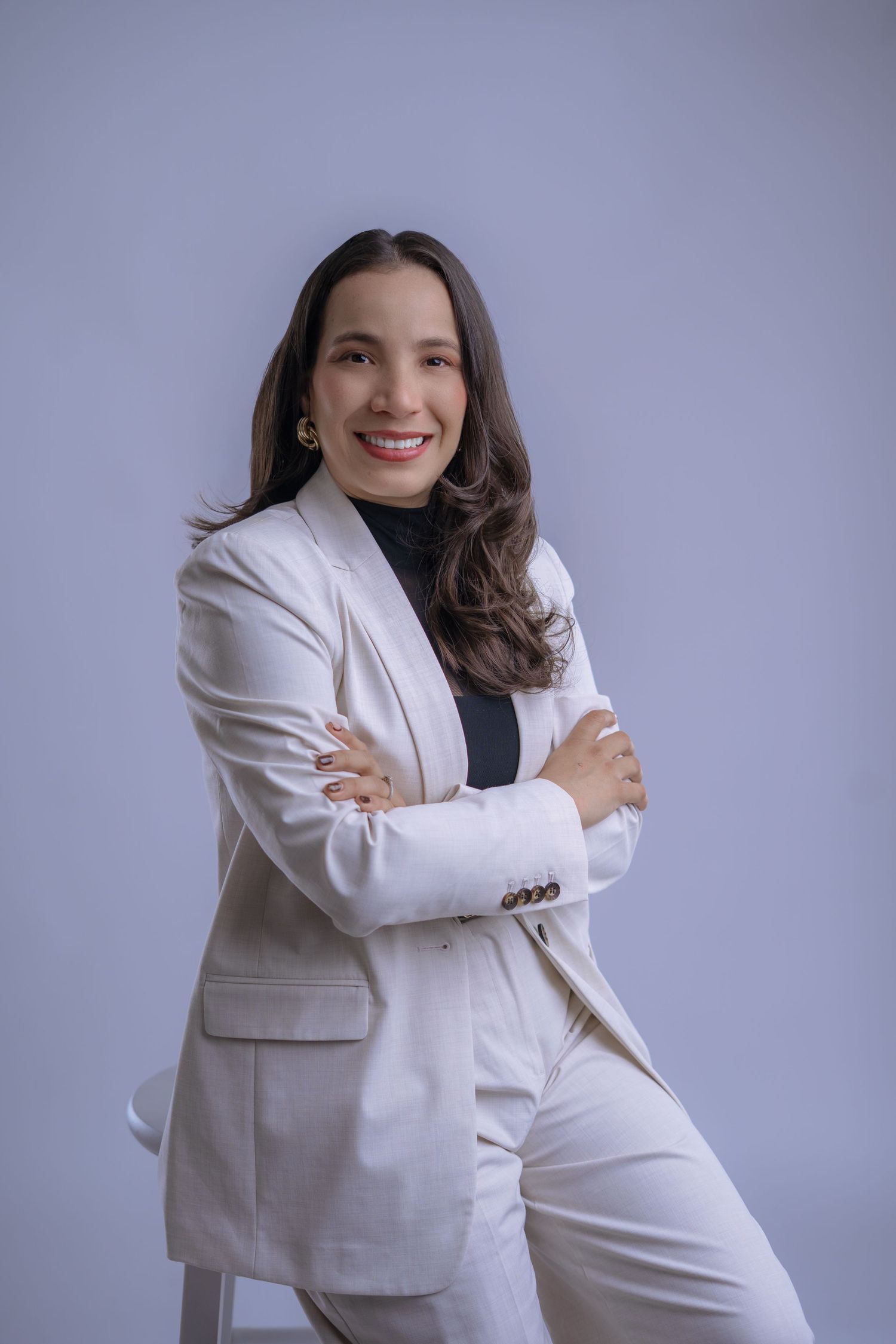 Professional portrait series showing a person in a white blazer striking different dynamic poses against a gray backdrop.