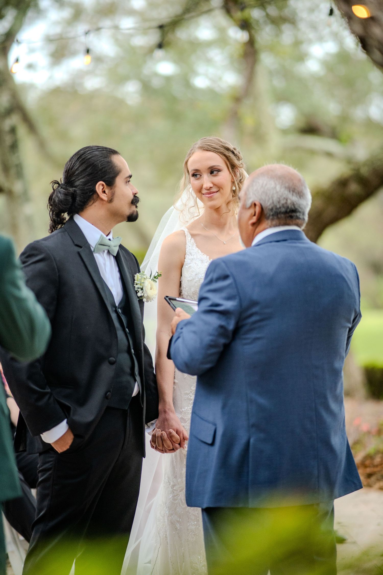 A series of candid outdoor wedding moments showing a couple and officiant during the marriage ceremony.