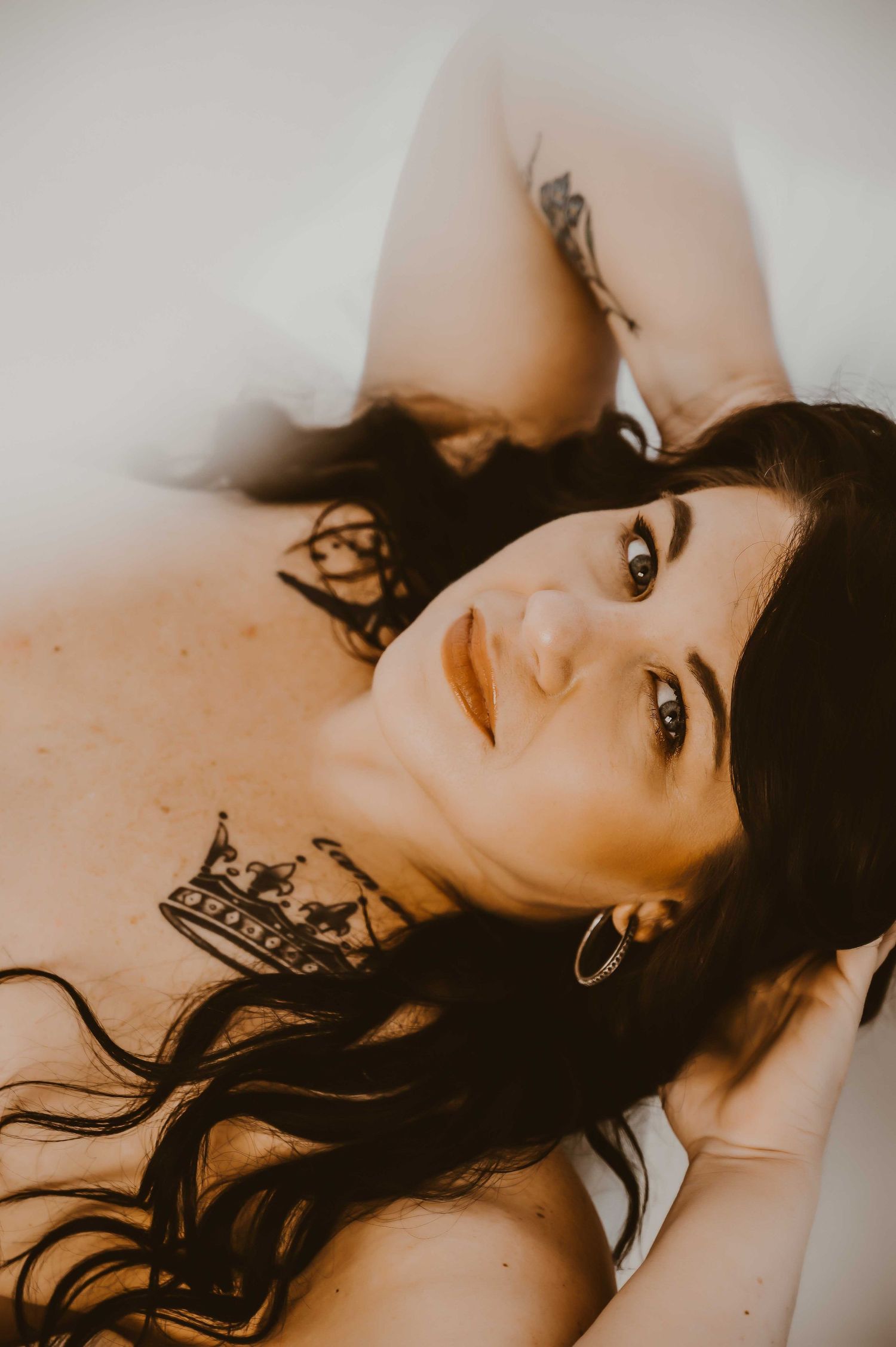 Boudoir photography Ashland KY – confident woman reclining, bold and beautiful.