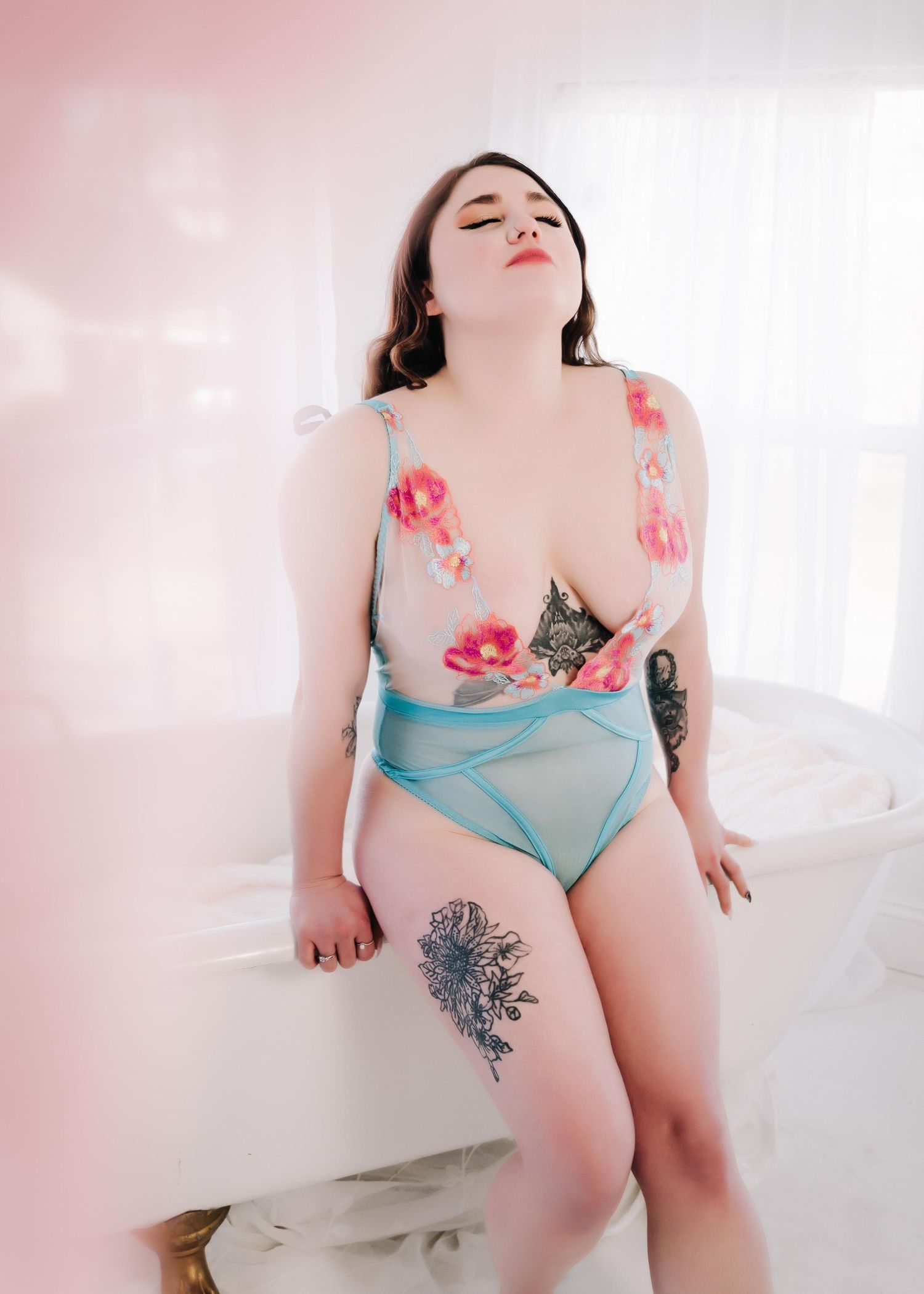Boudoir photography Ashland KY – woman in floral lingerie, serene and confident.