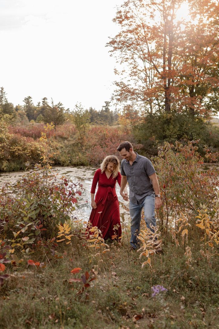 Maternity couple portraits on a sunny, fall afternoon, at Cataraqui Conservation Area, Kingston, Ontario. Couple are wal
