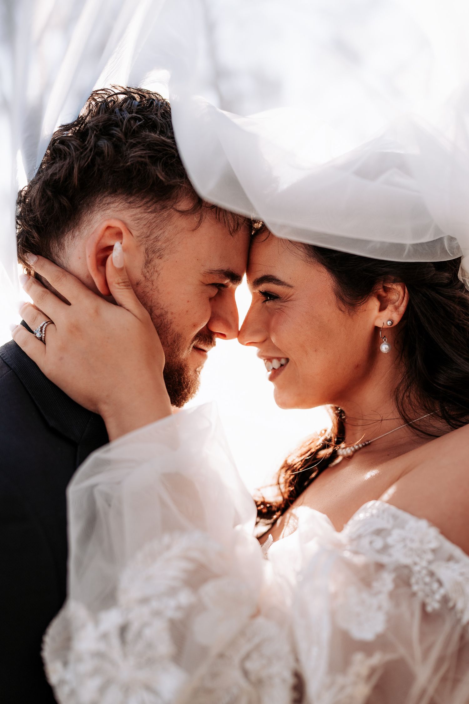 Newlywed couple shares intimate romantic moments in a sequence of dreamy wedding photos with delicate lace details.