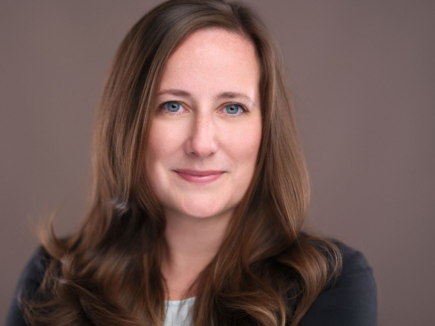 A professional headshot series showing the same person with various expressions and poses against a dark background.