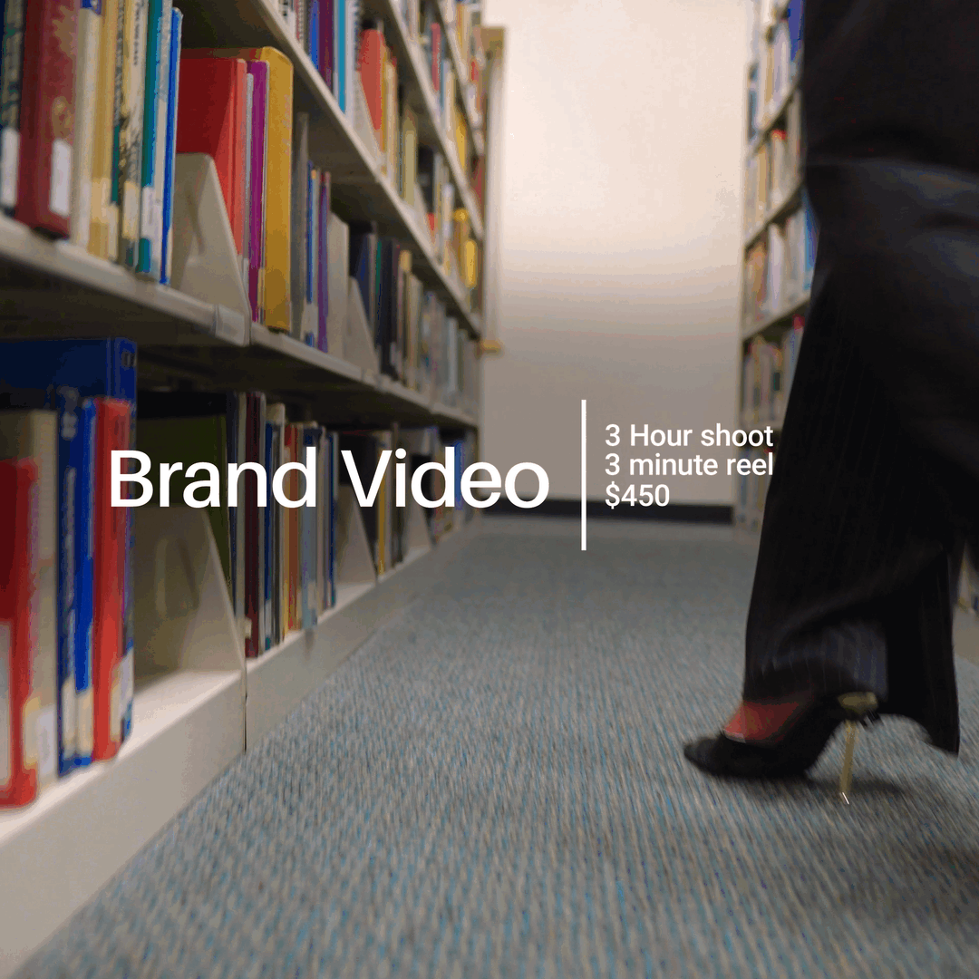 A library bookshelf with a person walking past and text overlay reading 'Brand Video' with video details.