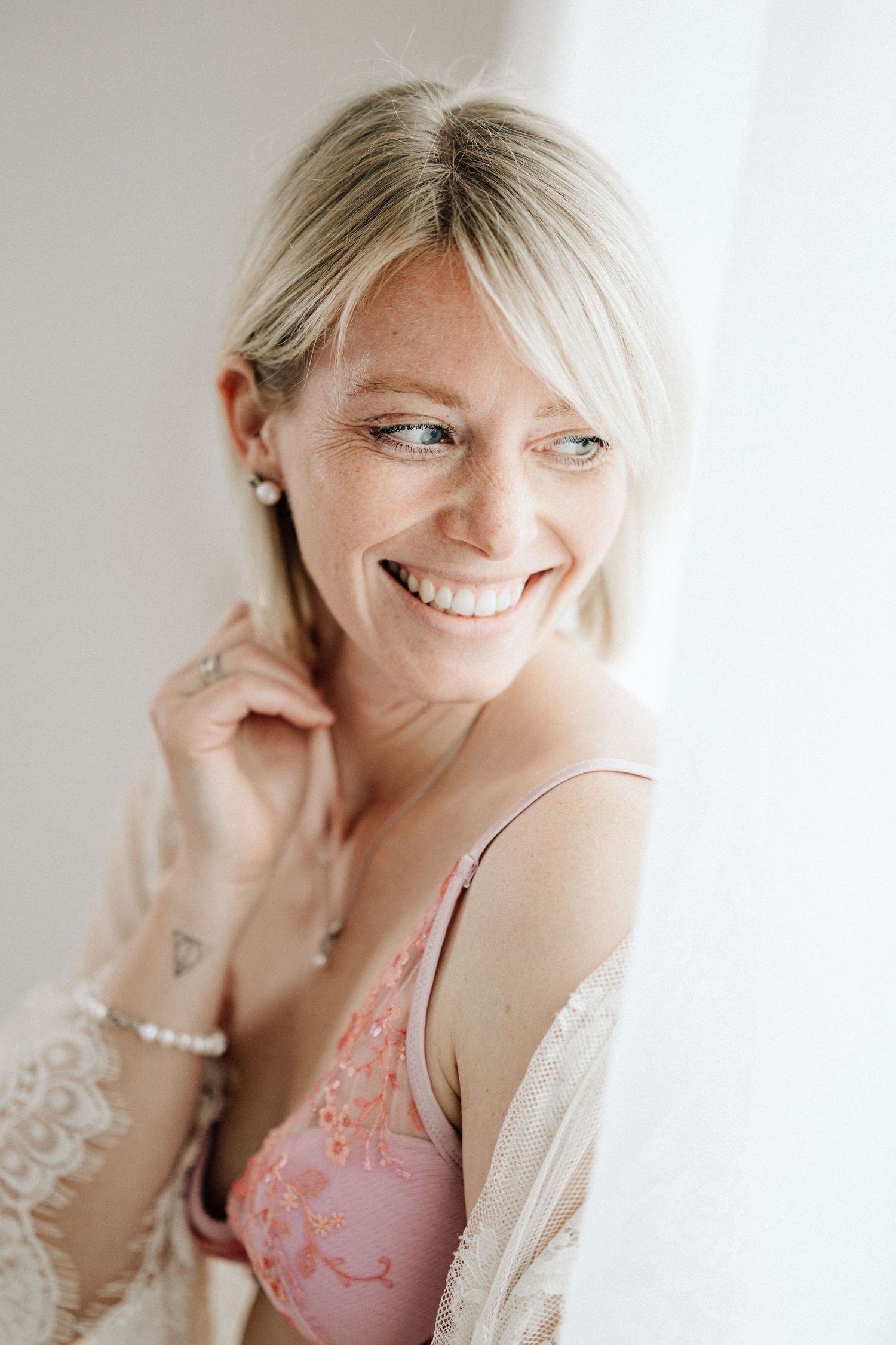 Artistic portrait set showing side profile and closeup expressions in soft lighting against a white background.