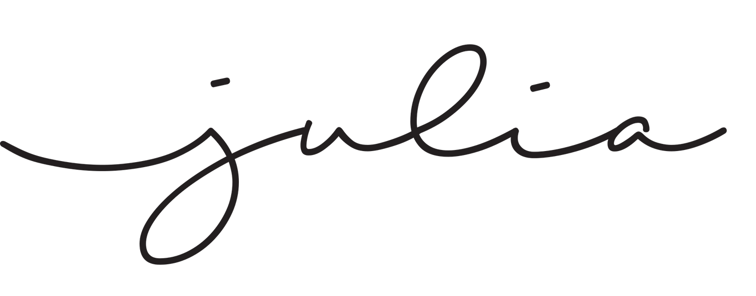 Elegant handwritten signature flowing across white paper.